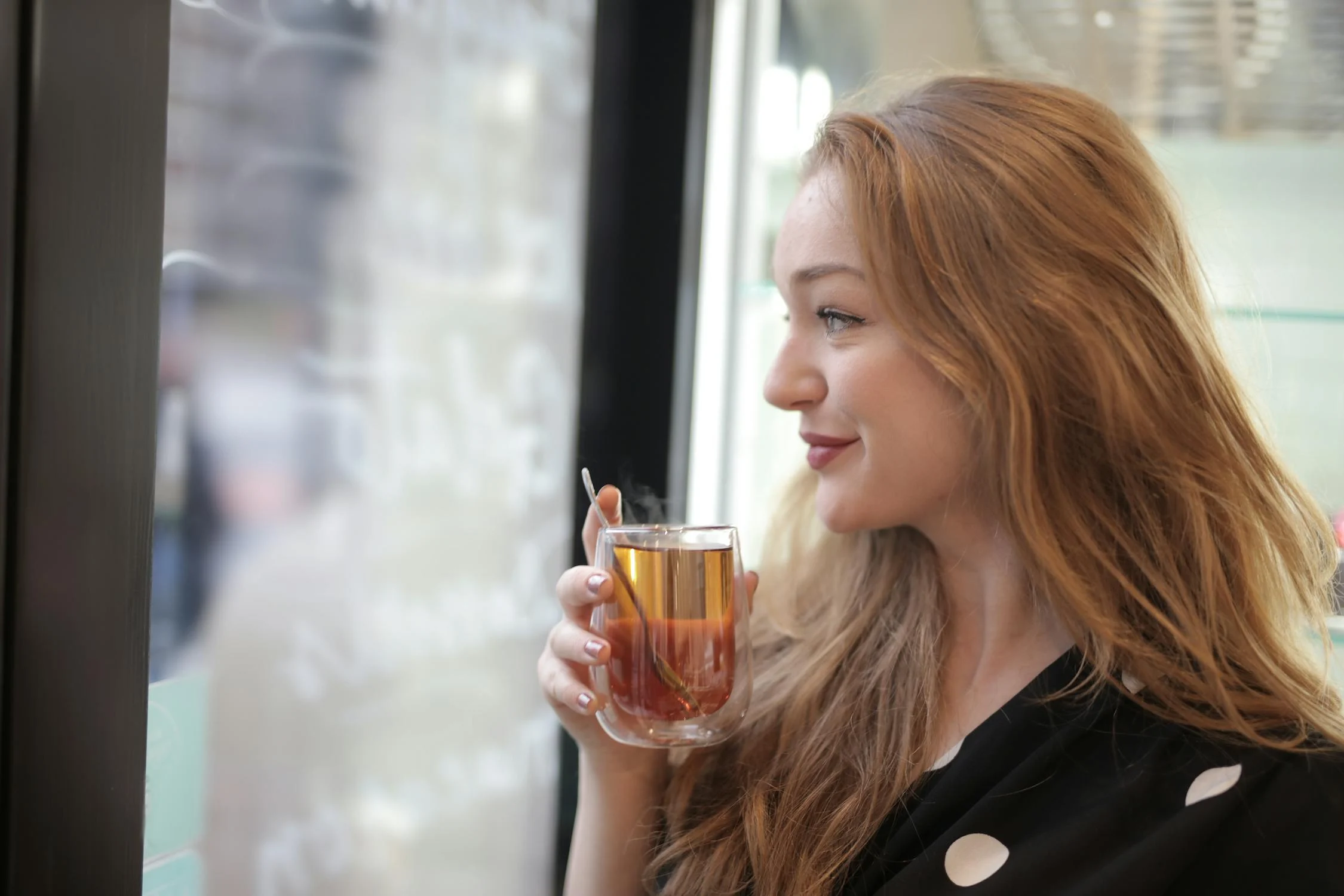 A satisfied smiling woman | Source: Pexels