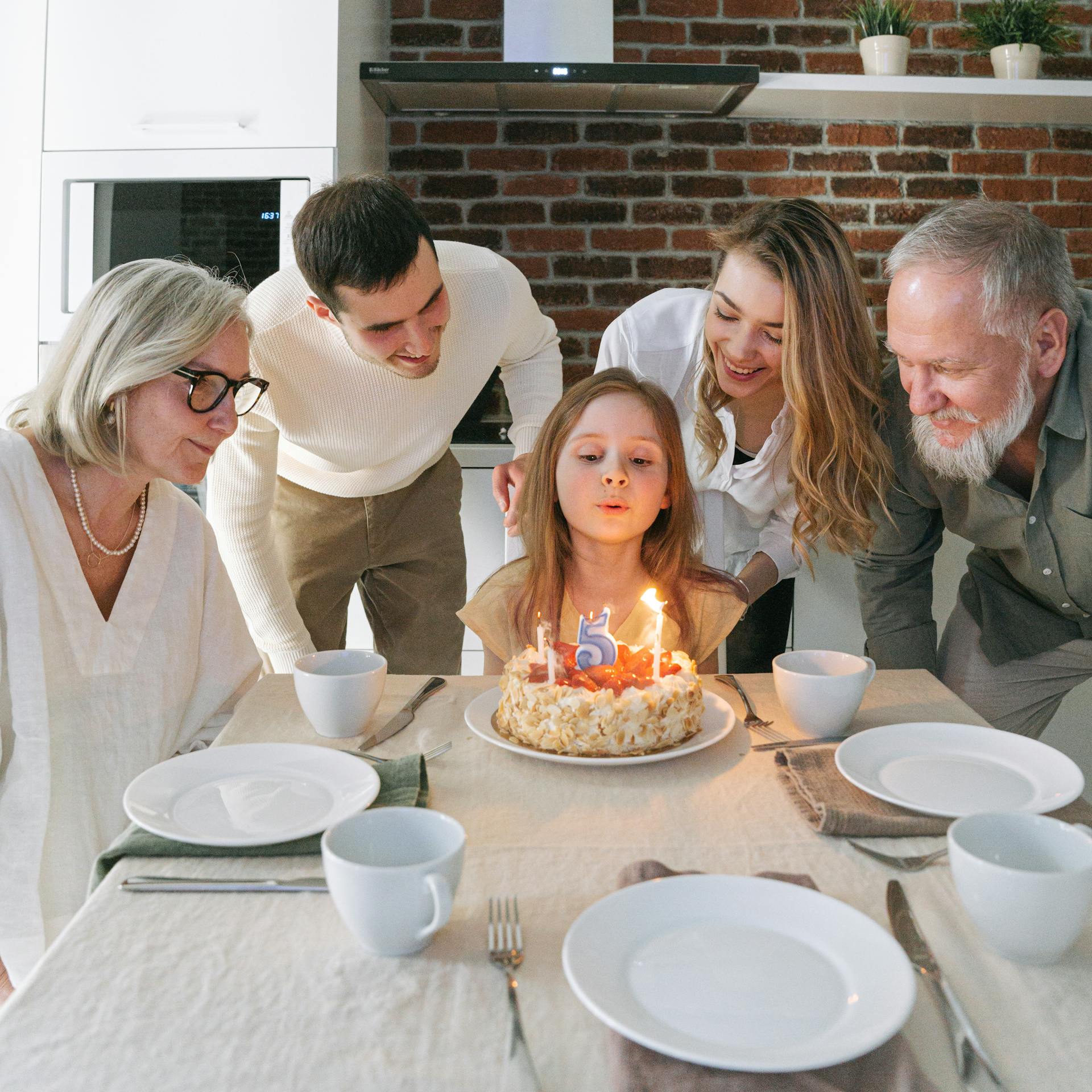 A family celebrating their little girl's birthday party | Source: Pexels