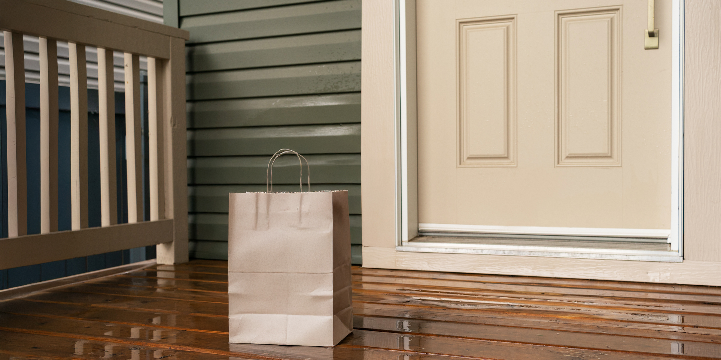 A gift bag left on a front doorstep | Source: Shutterstock