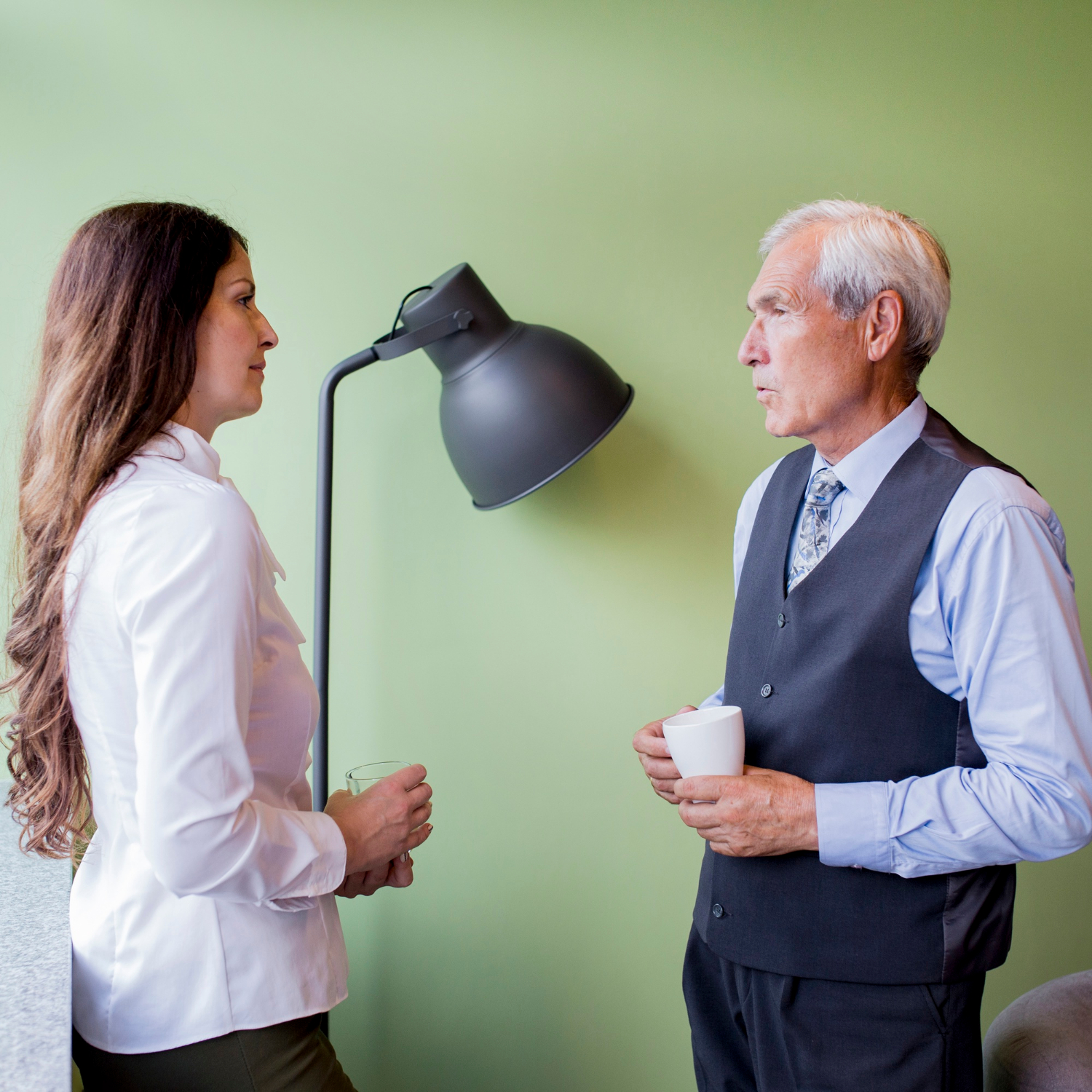 A woman and an older man facing each other | Source: Freepik