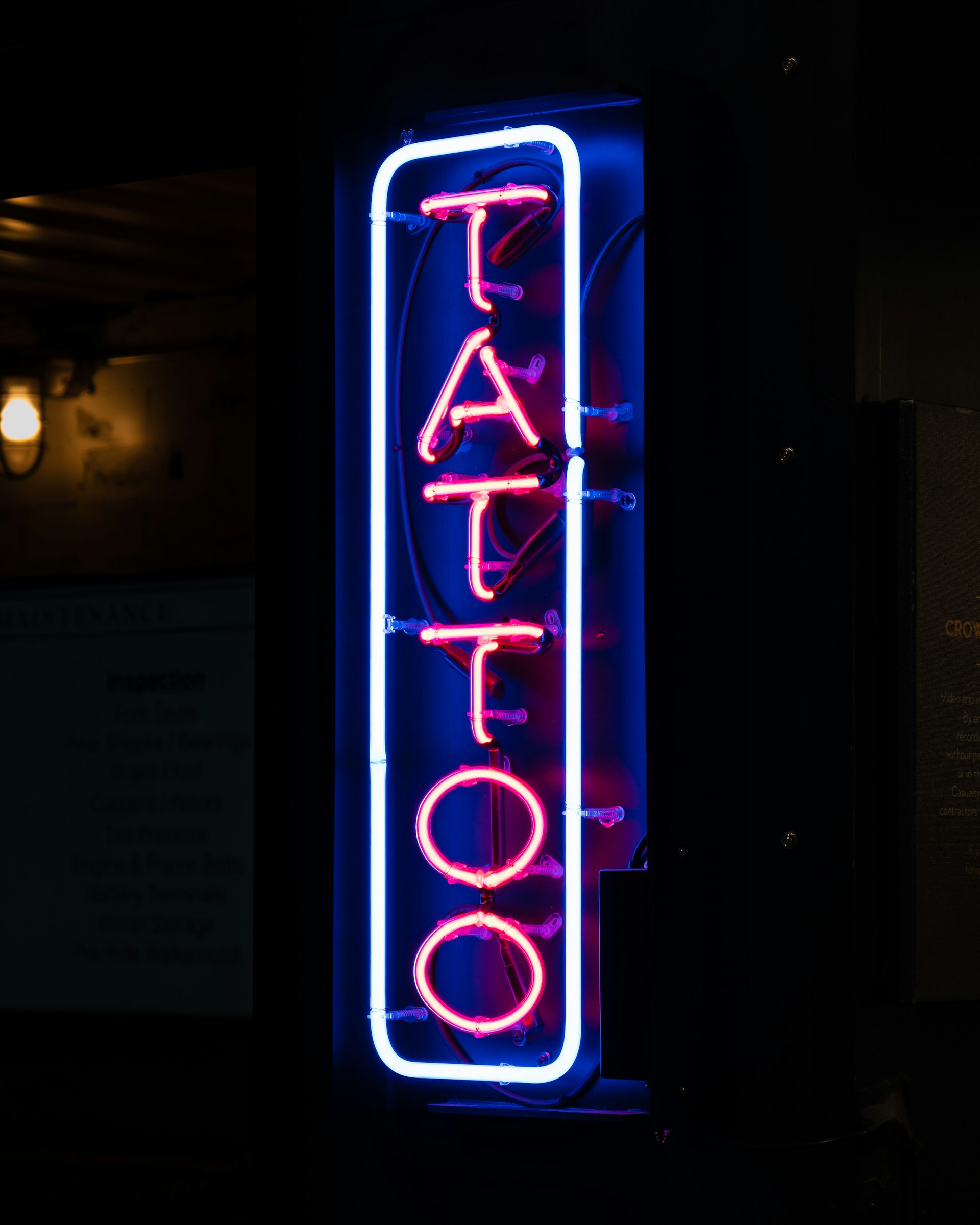 A tattoo shop sign | Source: Unsplash