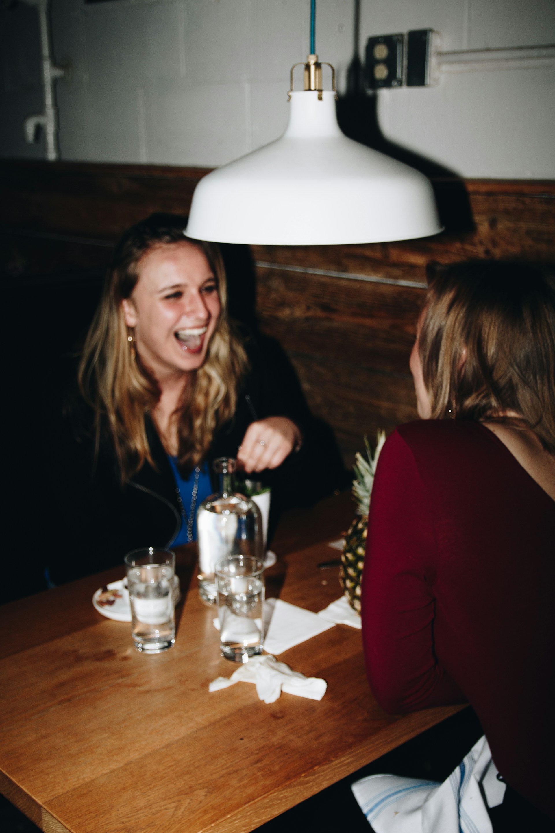 Two delighted women in a restaurant | Source: Unsplash