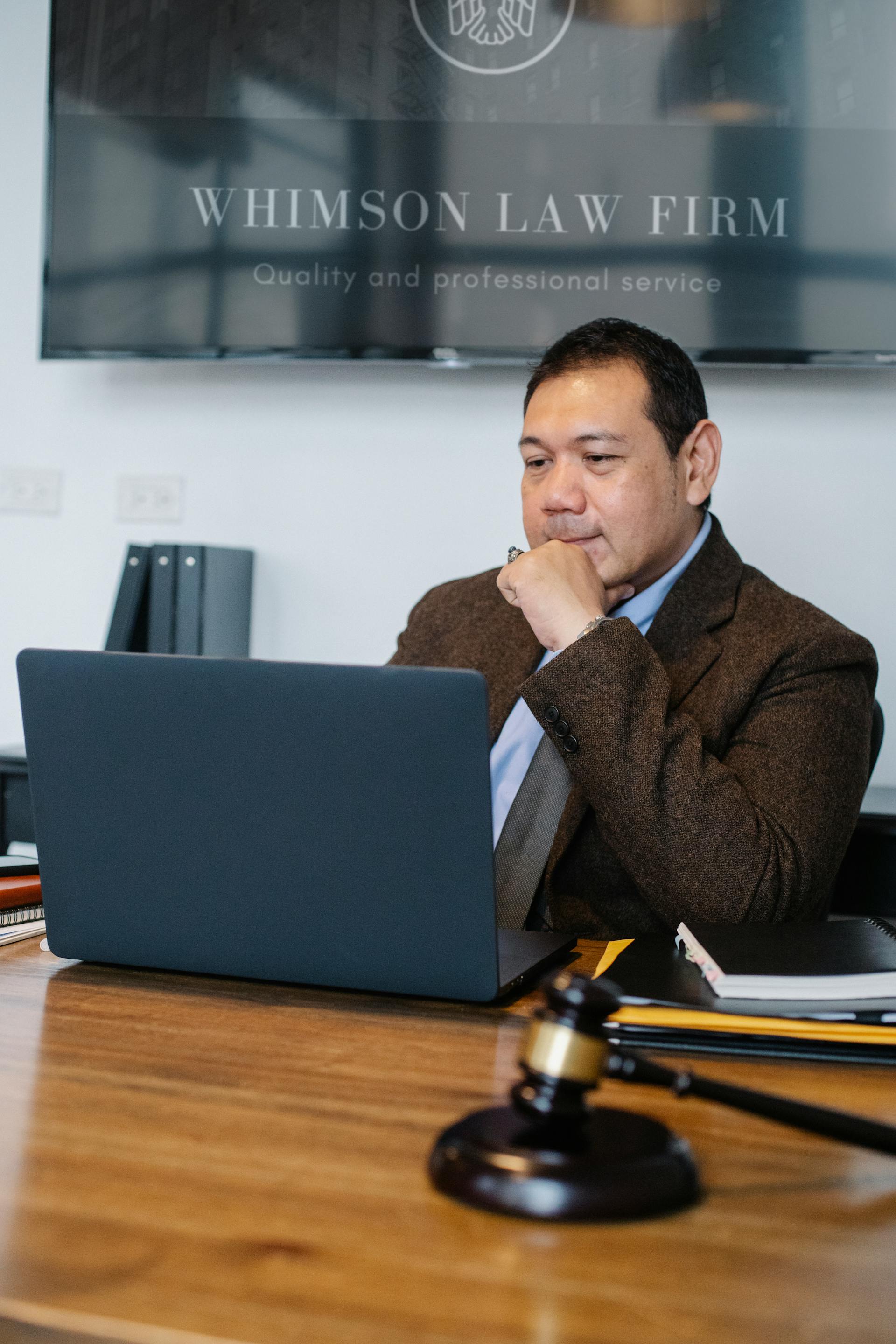 A lawyer sitting in his office | Source: Pexels