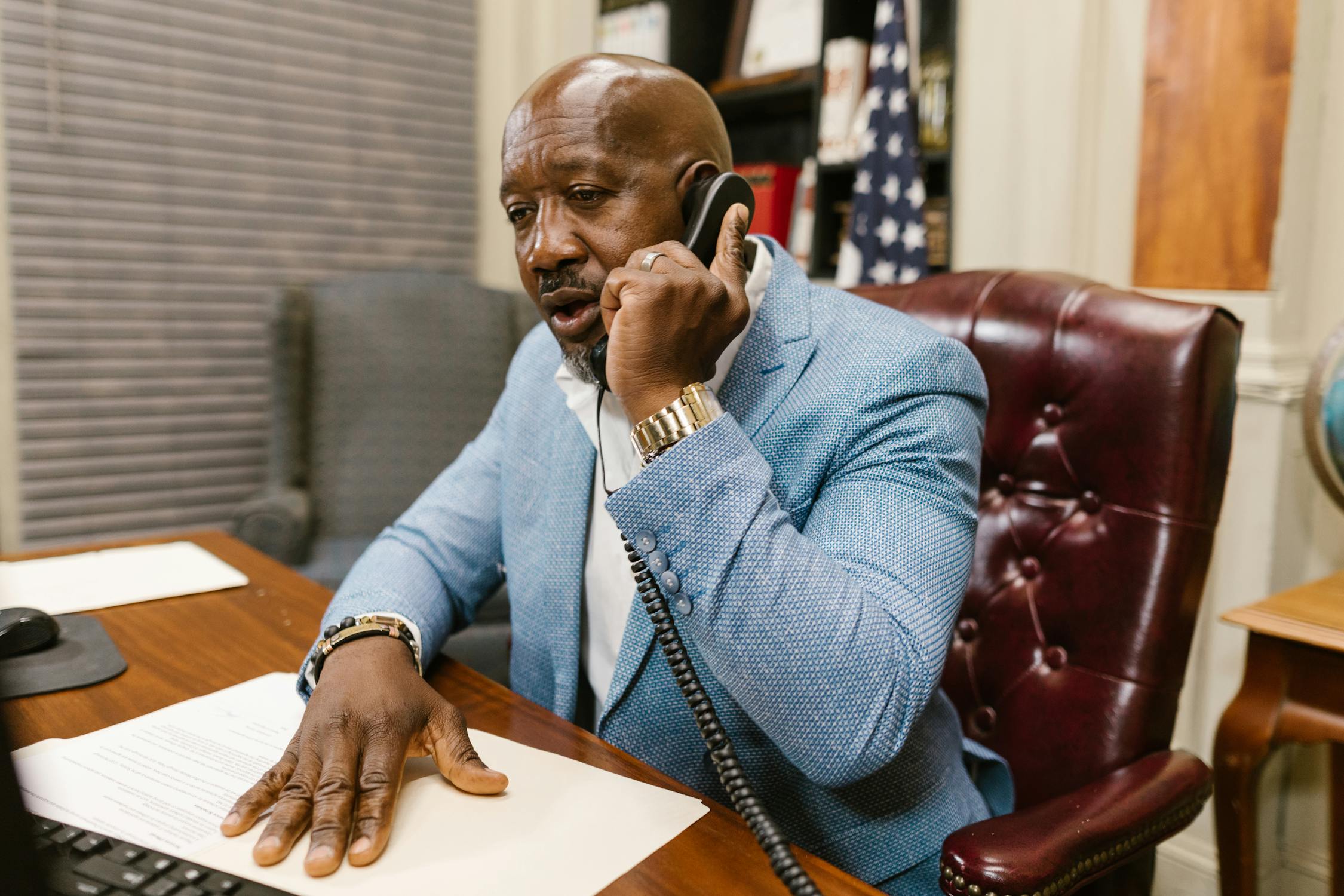 A lawyer talking on his phone | Source: Pexels