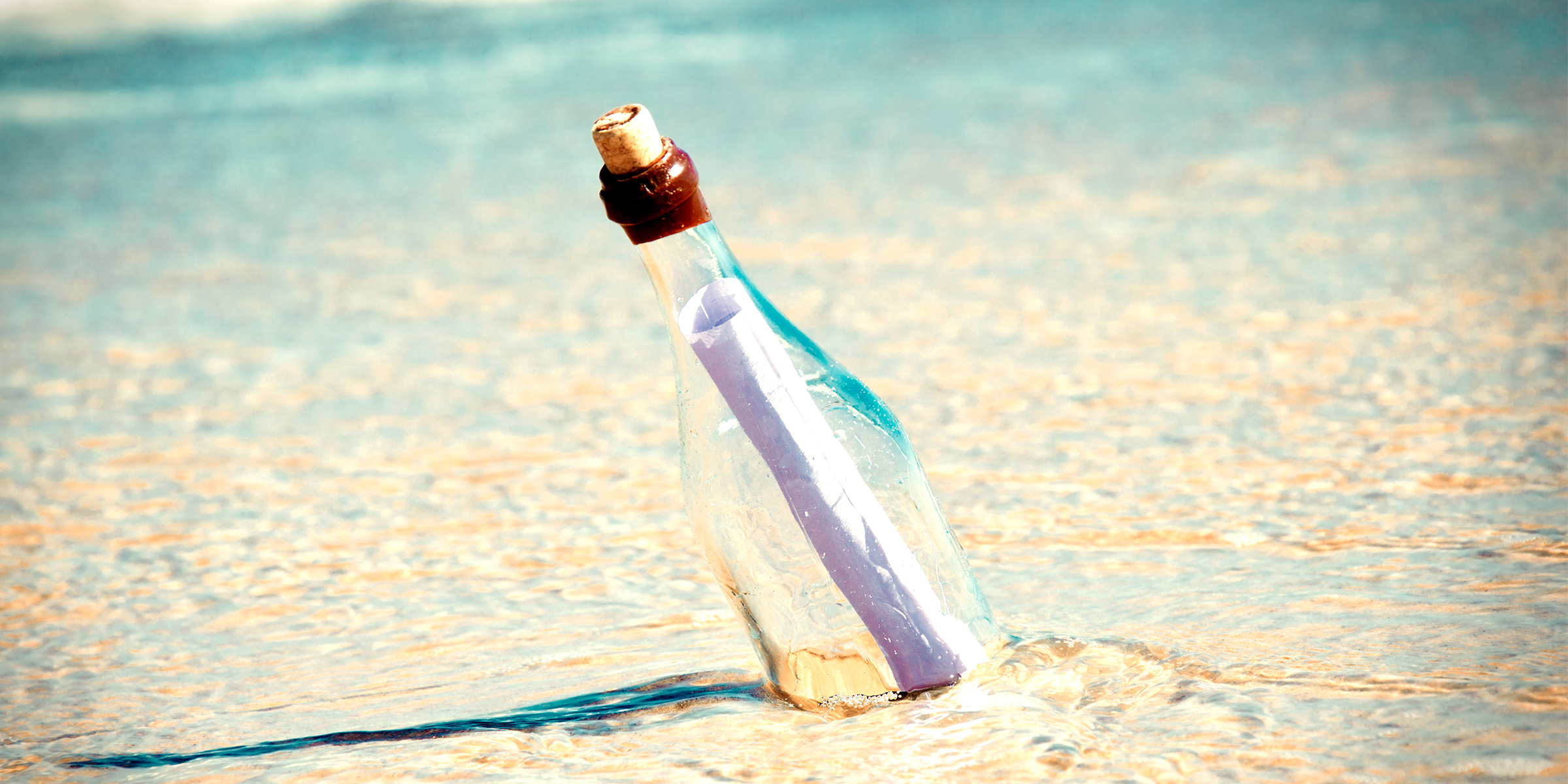 A bottle with a letter | Source: Freepik