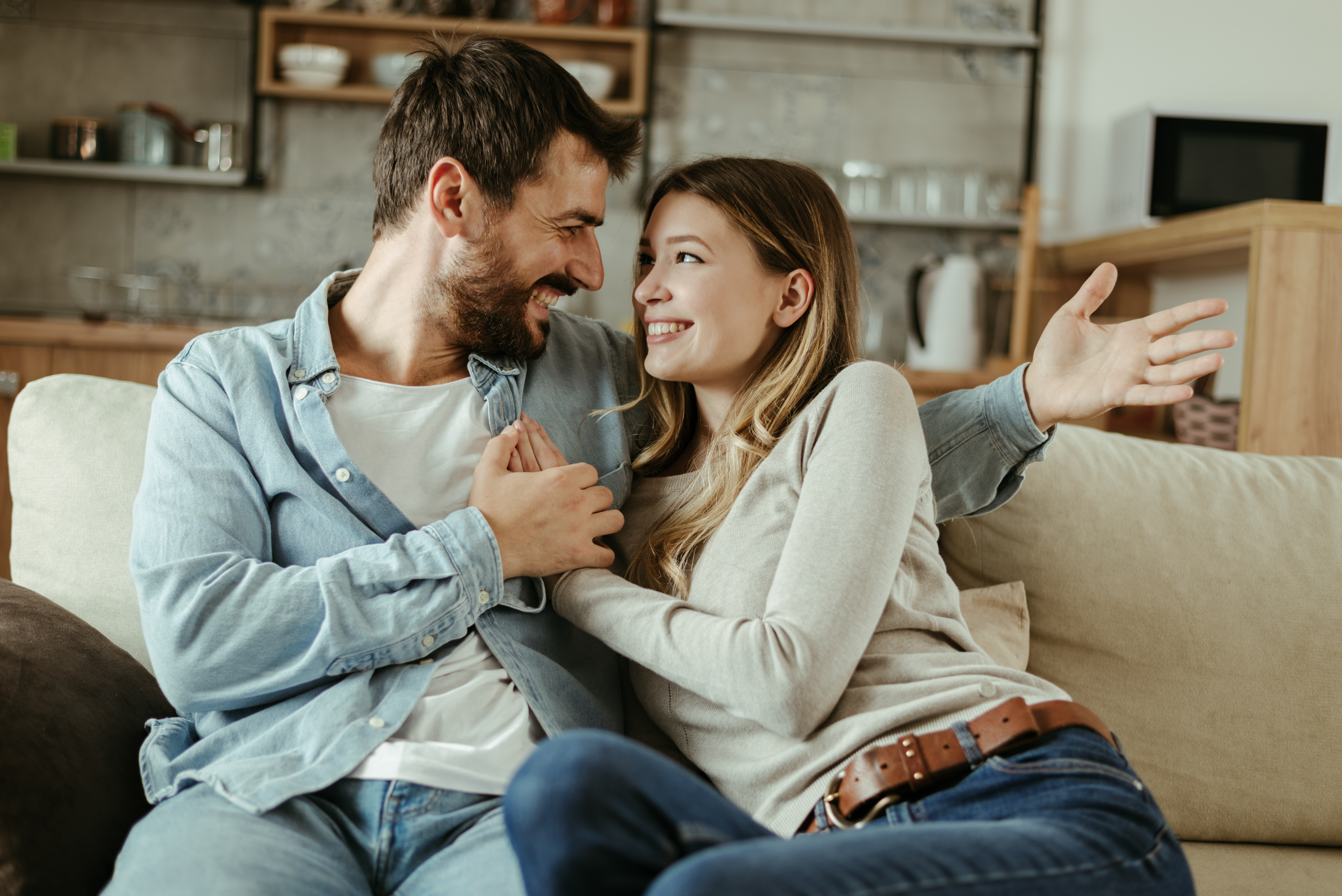 A couple conversing at home | Source: Shutterstock