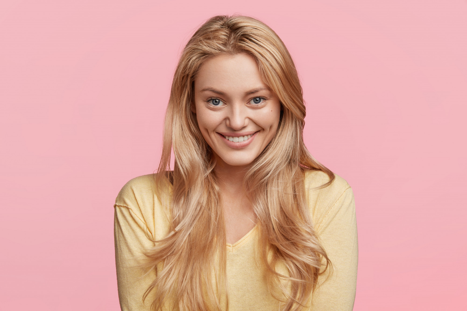 A cheerful woman smiling | Source: Freepik