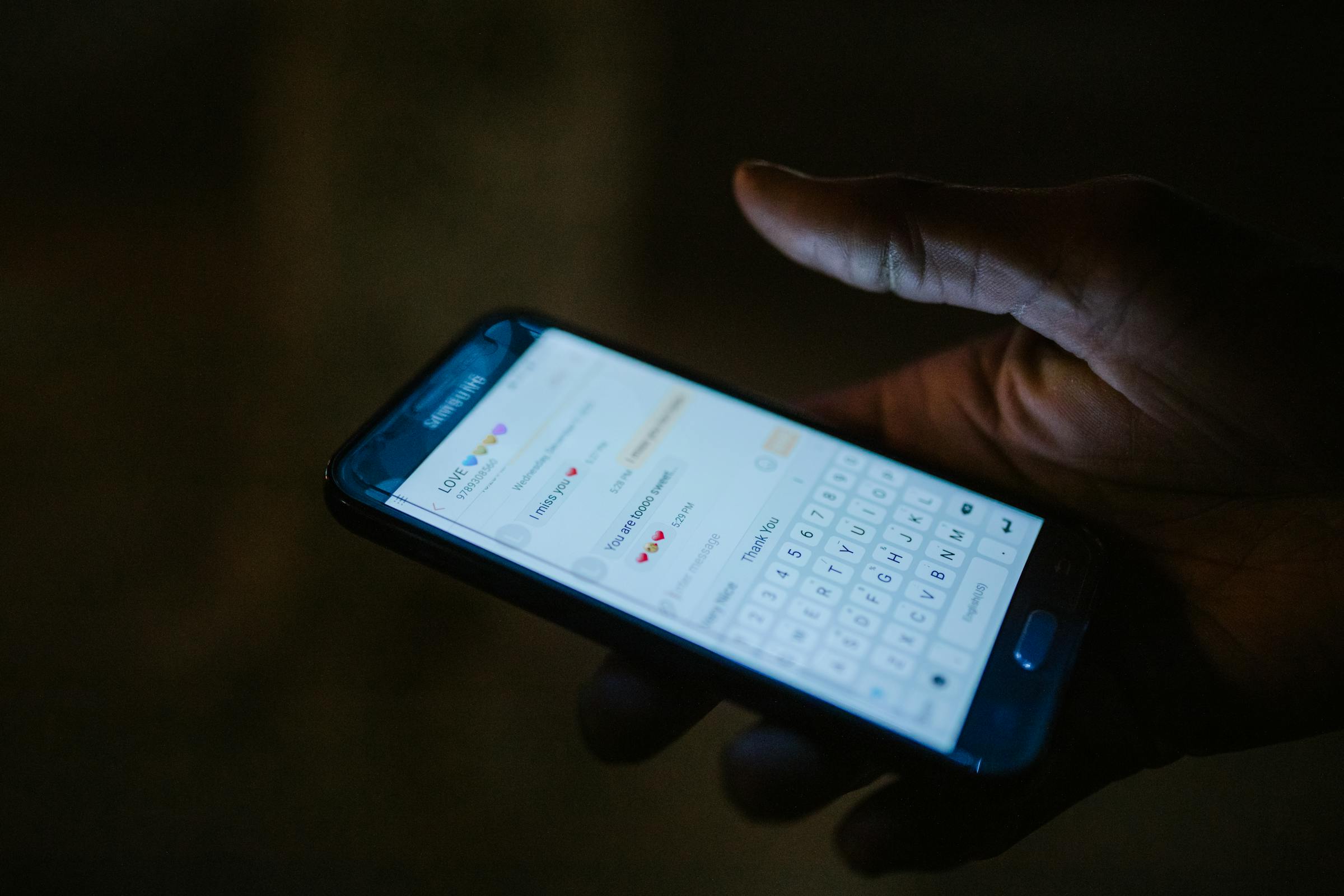 A phone showing a text conversation with emojis | Source: Pexels