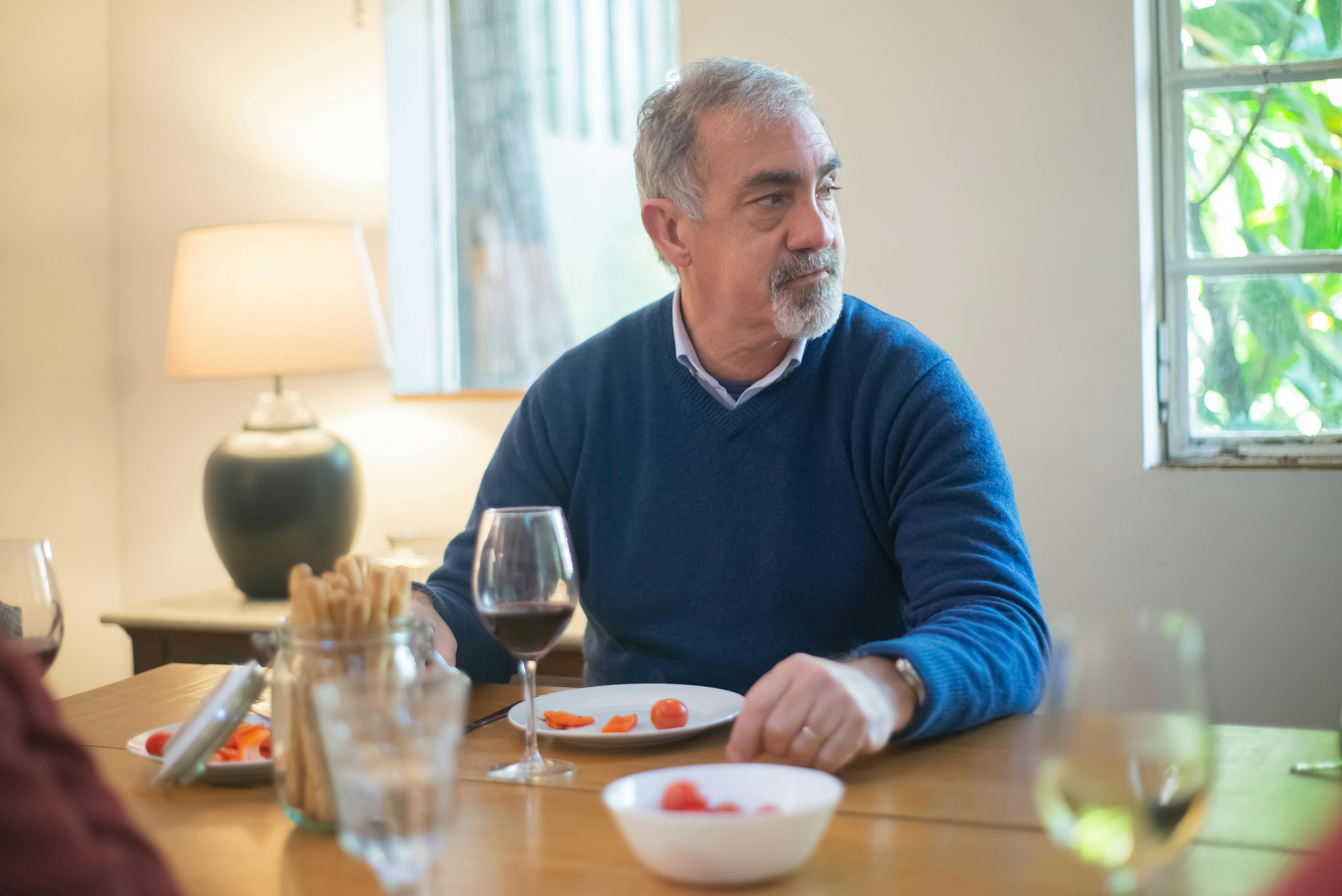 Senior man at a dinner table | Source: Pexels