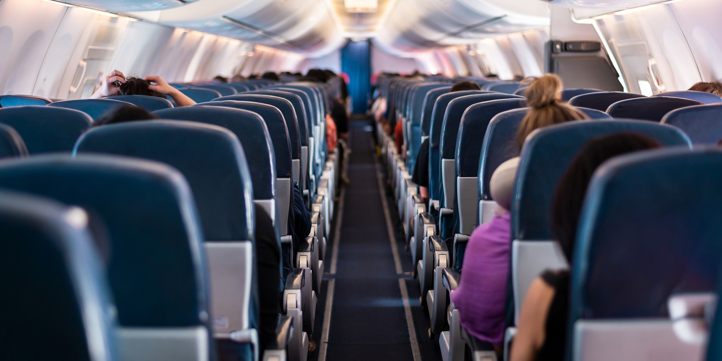 Passengers on an airplane | Source: Shutterstock