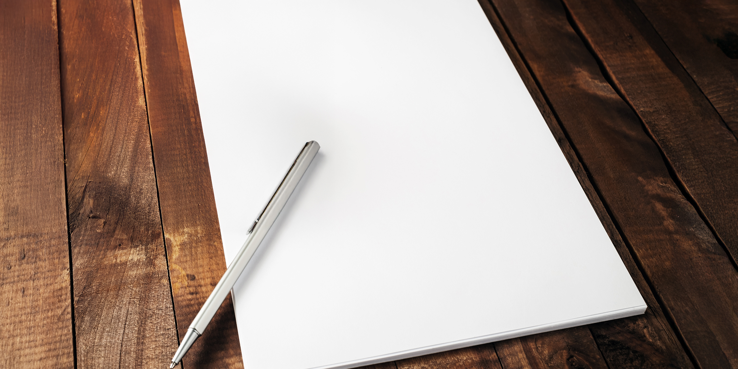 A pen and a sheet of paper | Source: Shutterstock