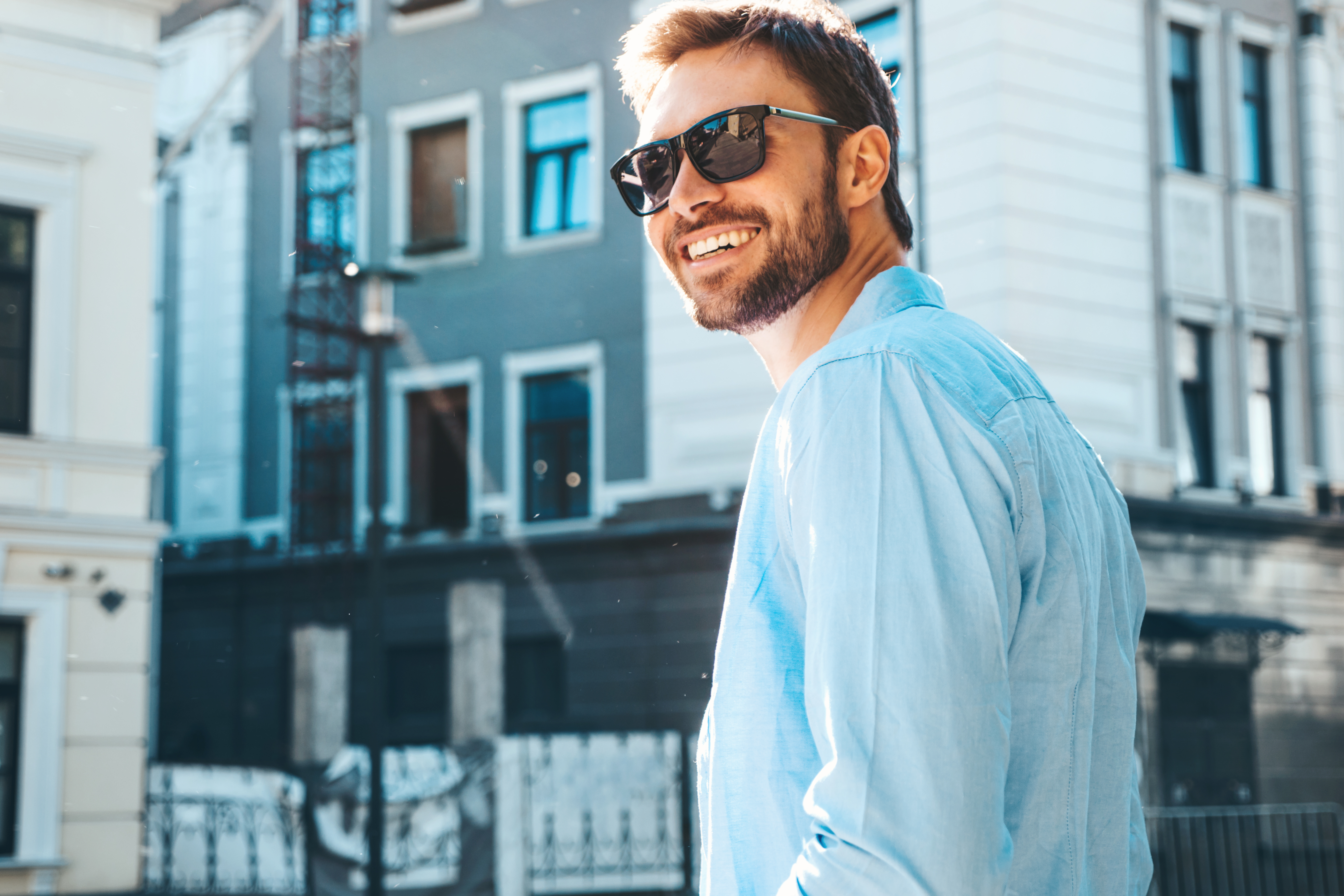 A young man smiling | Source: Shutterstock