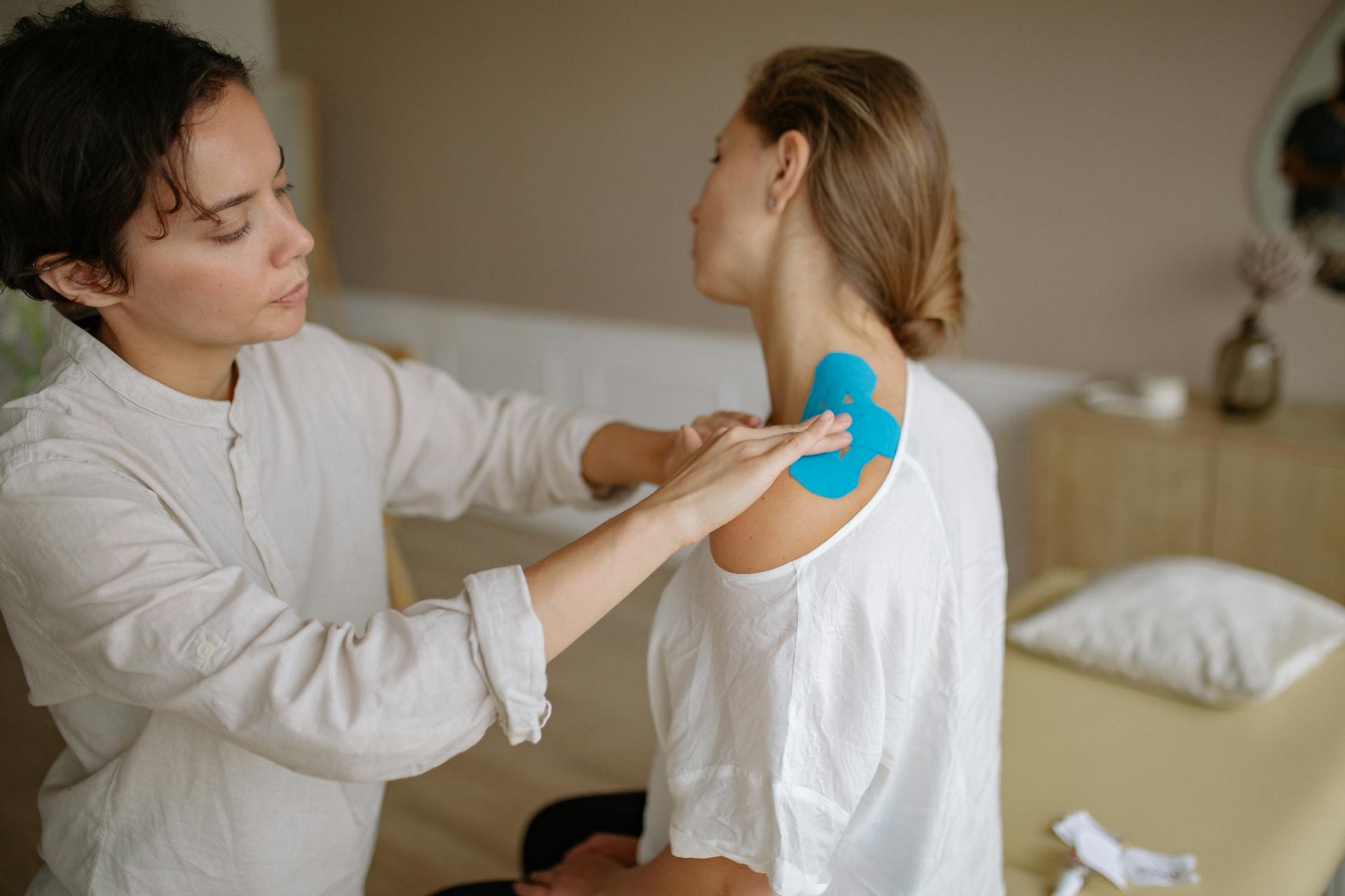 A physiotherapist with her client | Source: Pexels