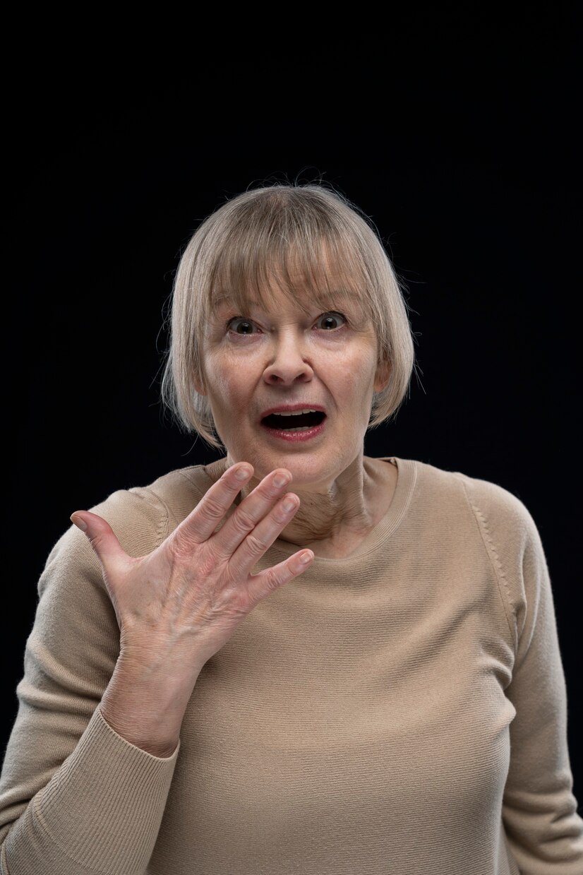 Shocked elderly woman | Source: Freepik