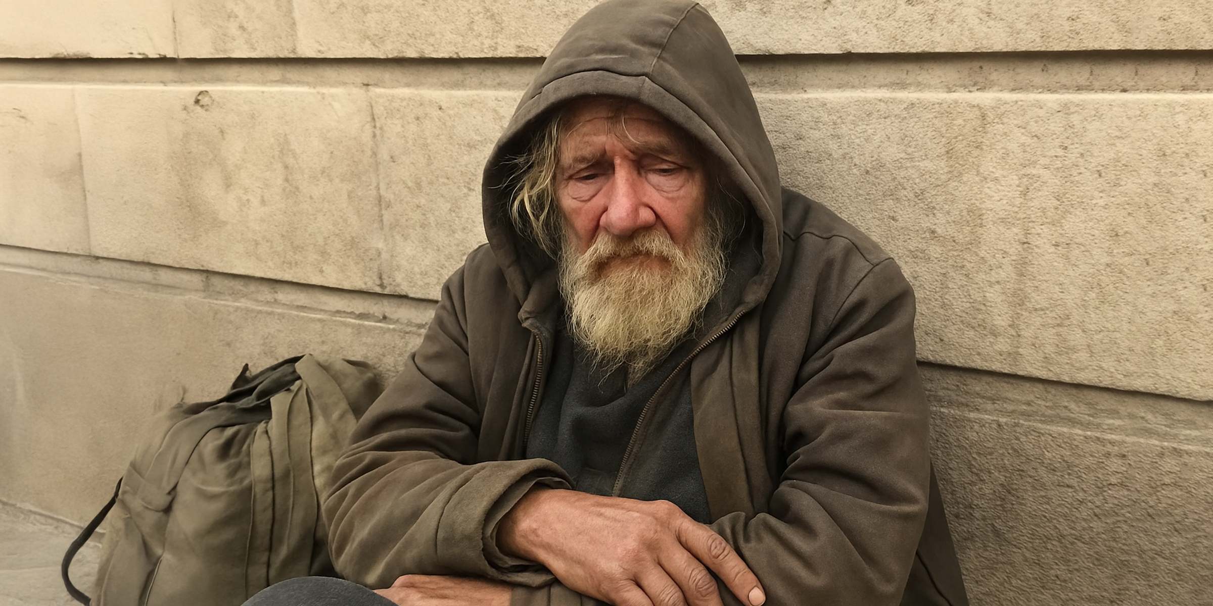 Homeless man sitting on the street | Source: Sora