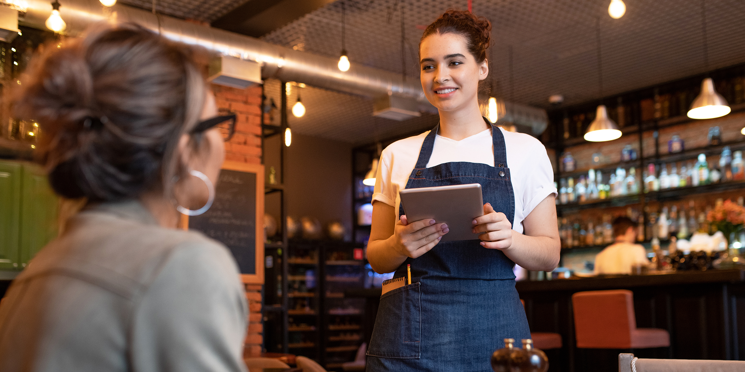 A waitress in a cafe | Source: Shutterstock