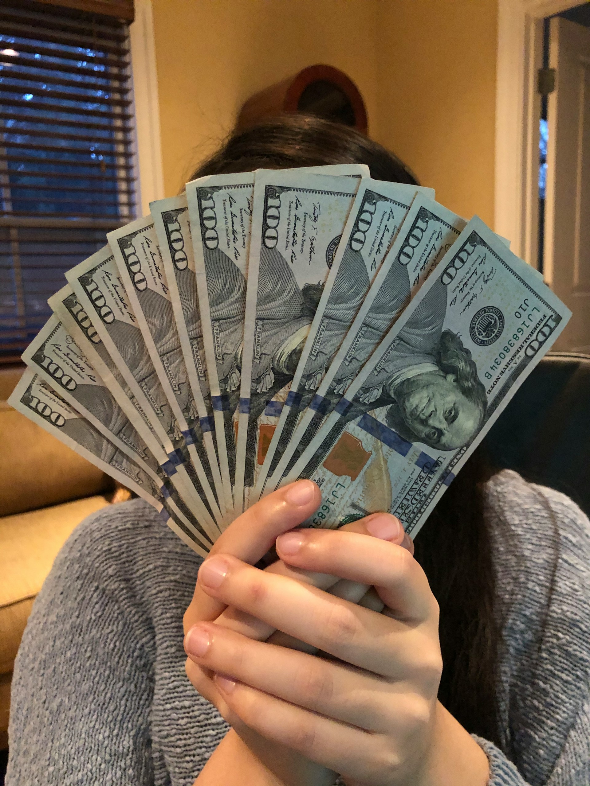 A woman holding money | Source: Unsplash