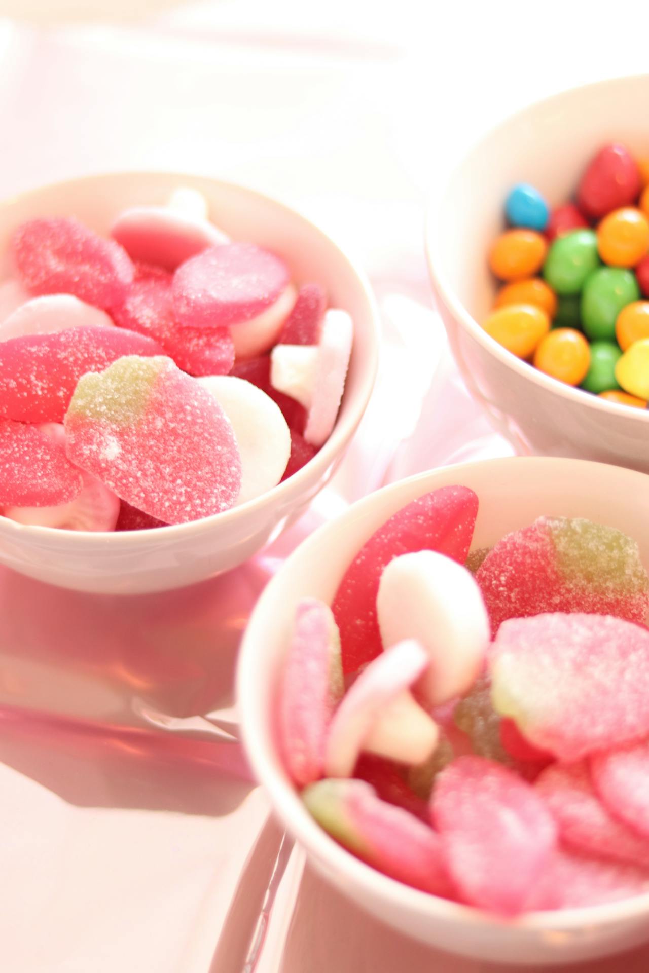 Colorful gummies and candies in bowls | Source: Pexels