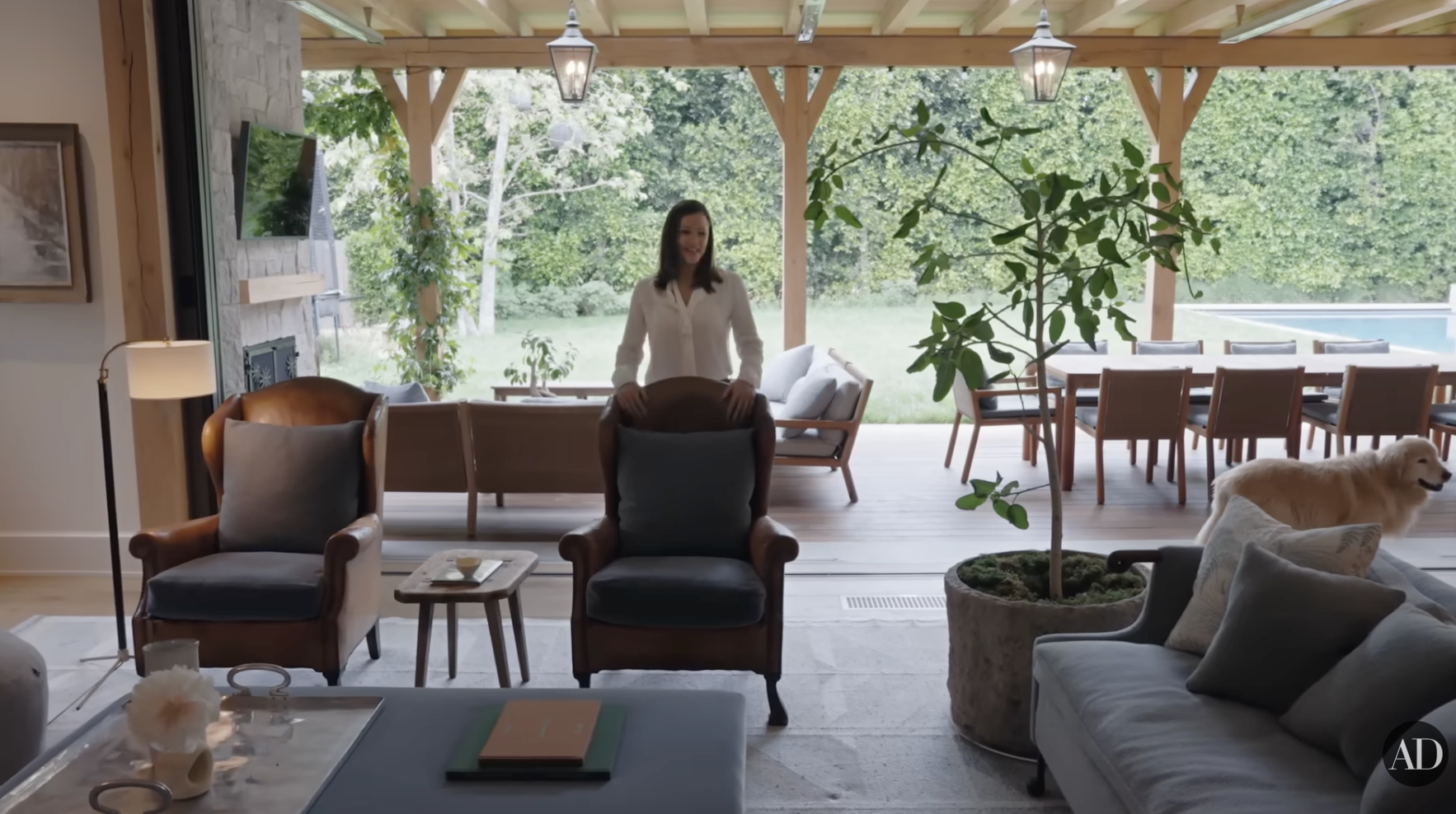 Jennifer Garner's living room and outdoor patio as seen on Architectural Digest's YouTube video posted on September 4, 2024. | Source: YouTube/Architectural Digest