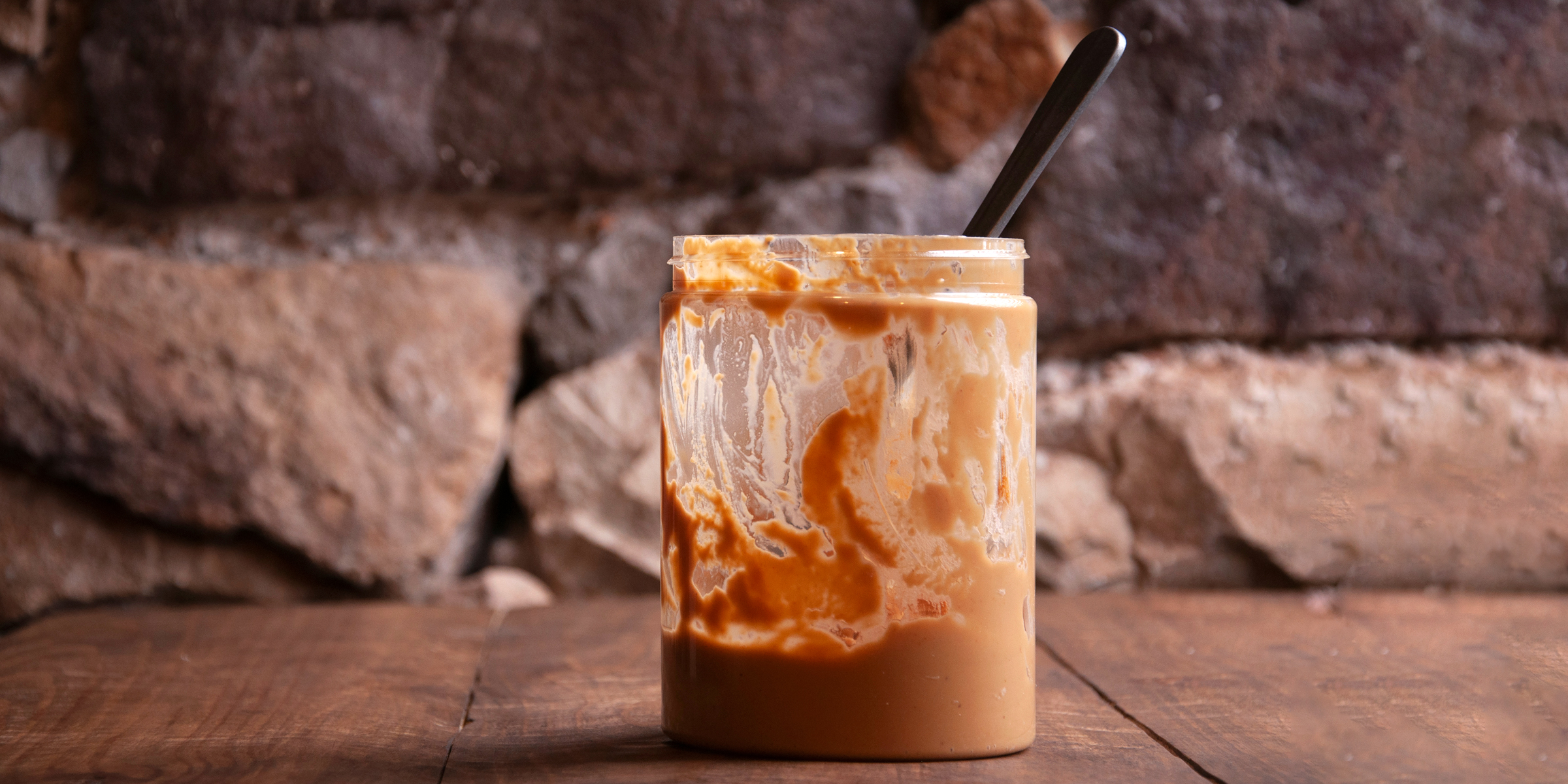 A half-empty jar of peanut butter | Source: Shutterstock