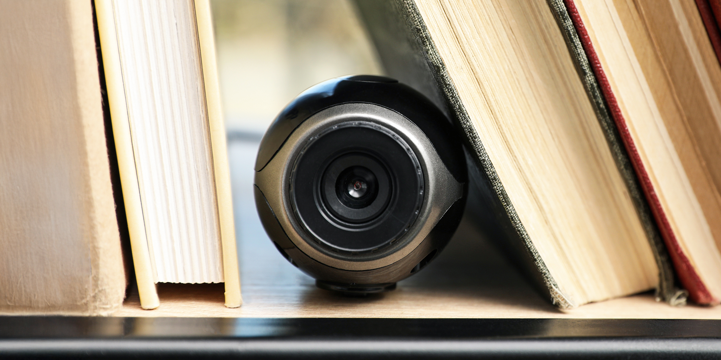 A small hidden camera on a shelf | Source: Shutterstock