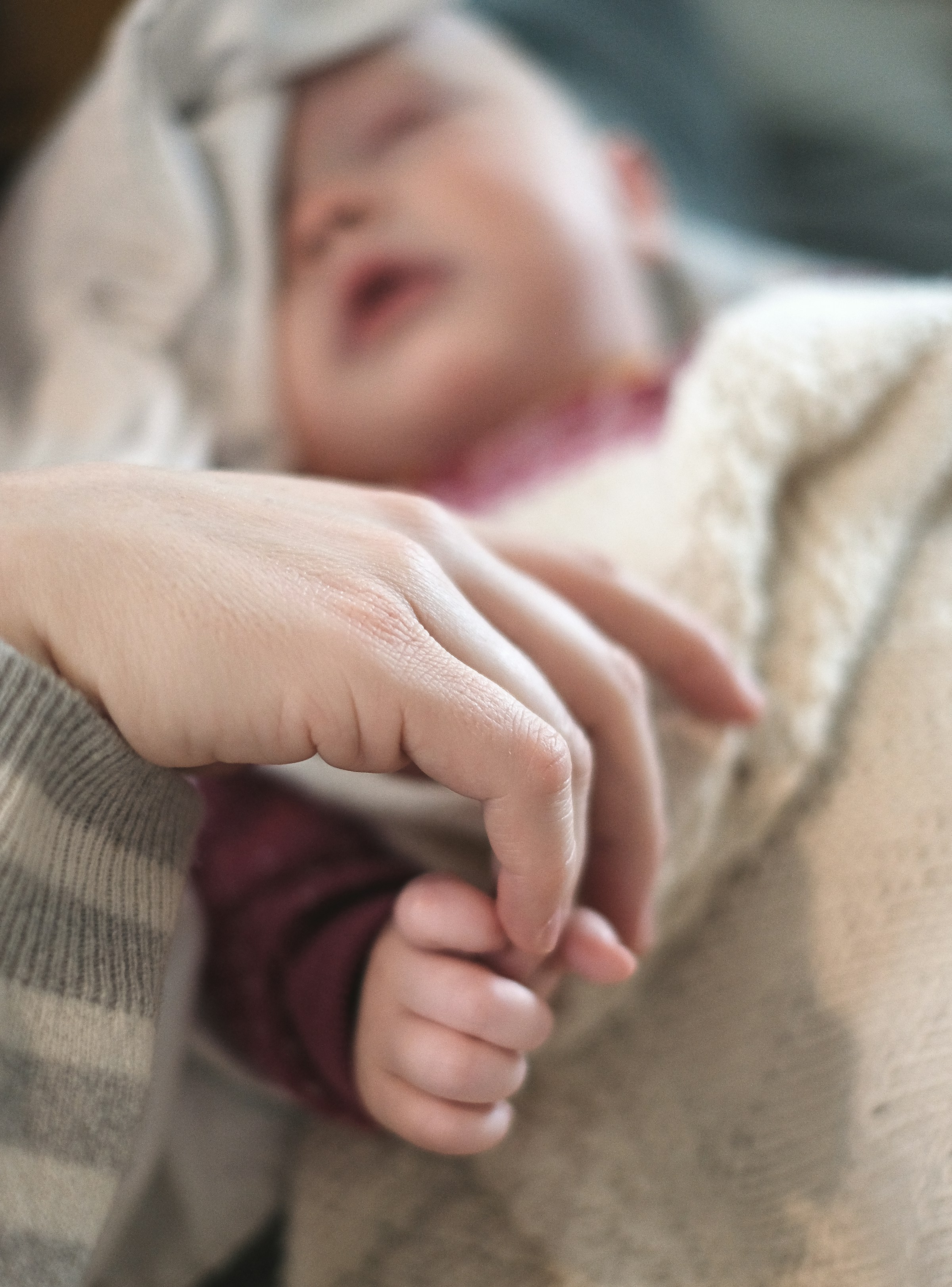 A mother holding a baby | Source: Unsplash