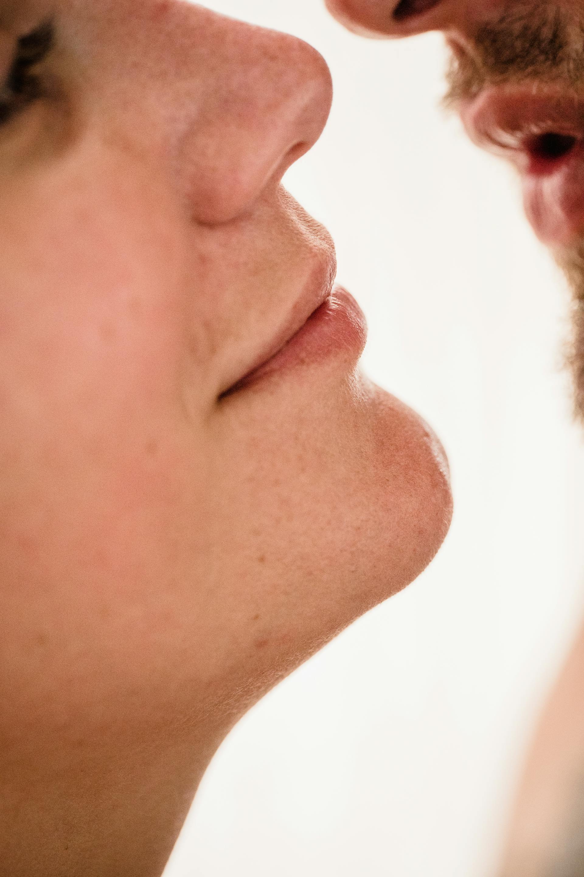 A close-up shot of a couple about to kiss | Source: Pexels