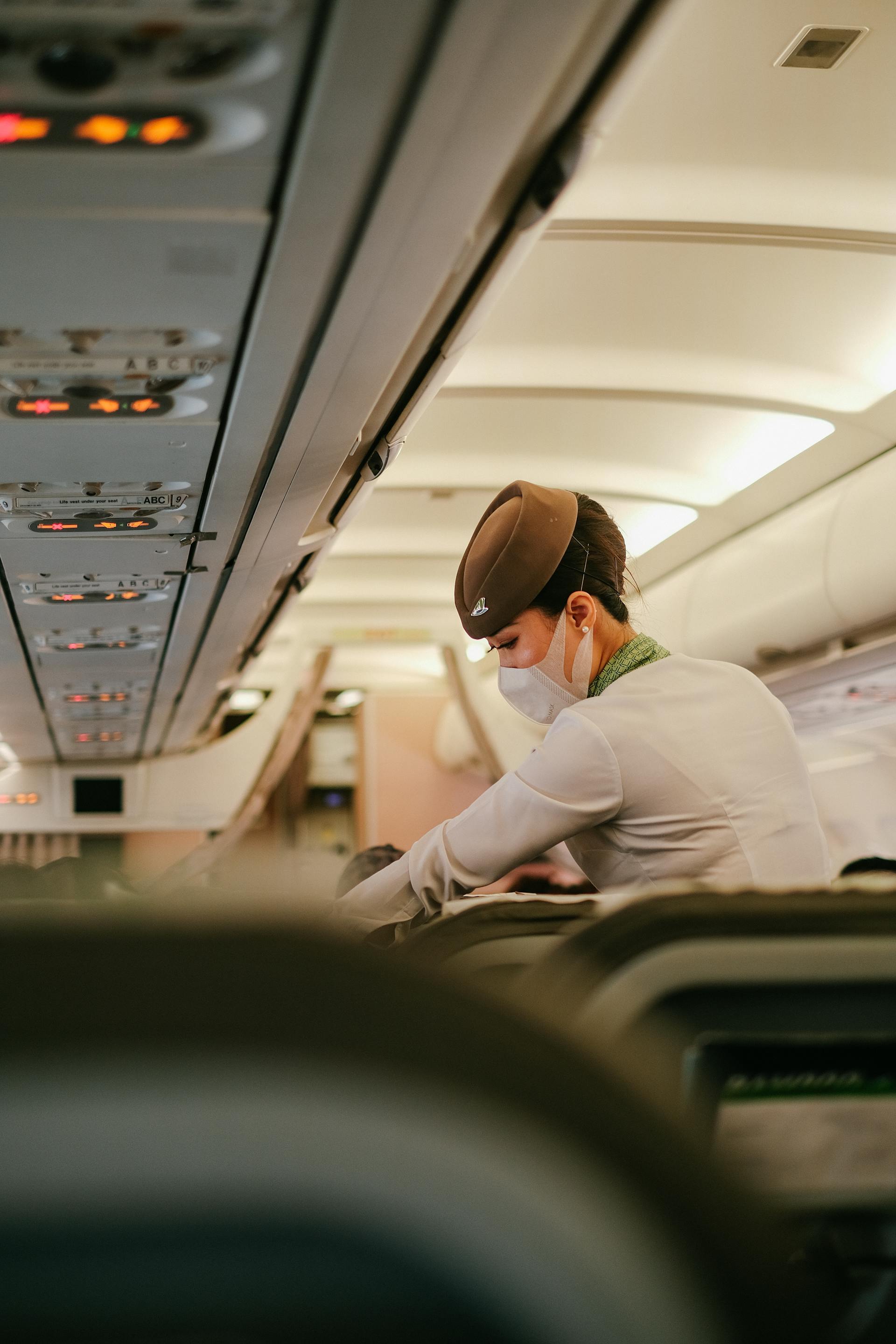 A flight attendant on a plane | Source: Pexels