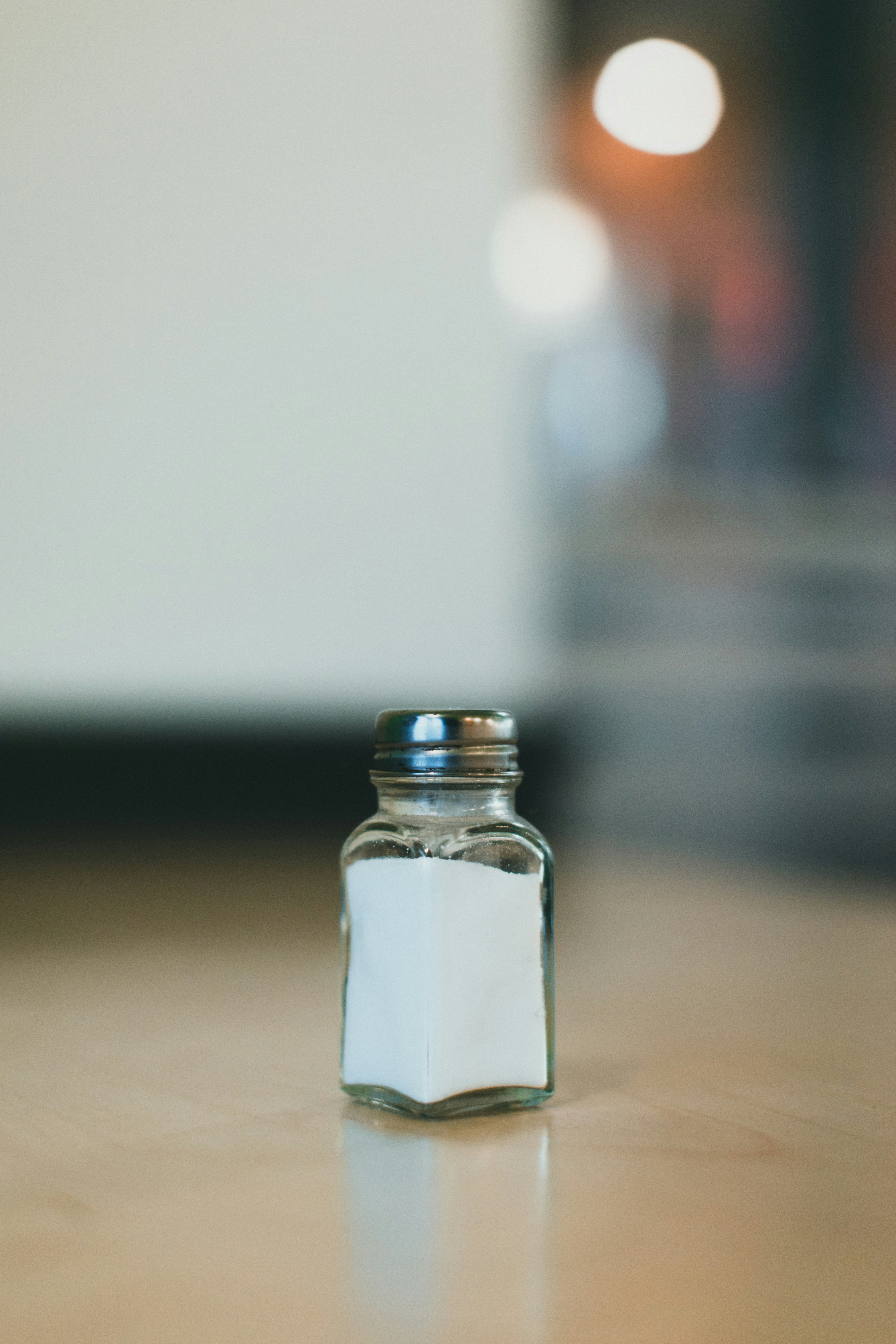 A salt shaker on a table | Source: Unsplash