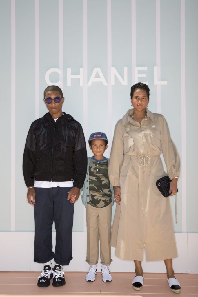  Pharrell Williams, Rocket Williams, and Helen Williams attend the Chanel Cruise 2018/19 Replica Show at Sermsuk Warehouse Pepsi Pier on October 31, 2018, in Bangkok, Thailand. | Photo: /Getty Images