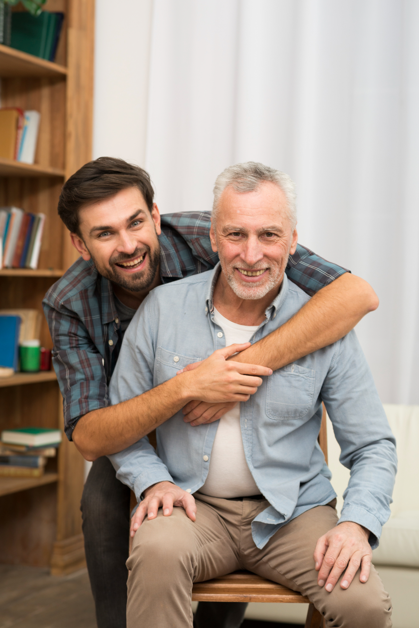 A younger man with an older one | Source: Freepik