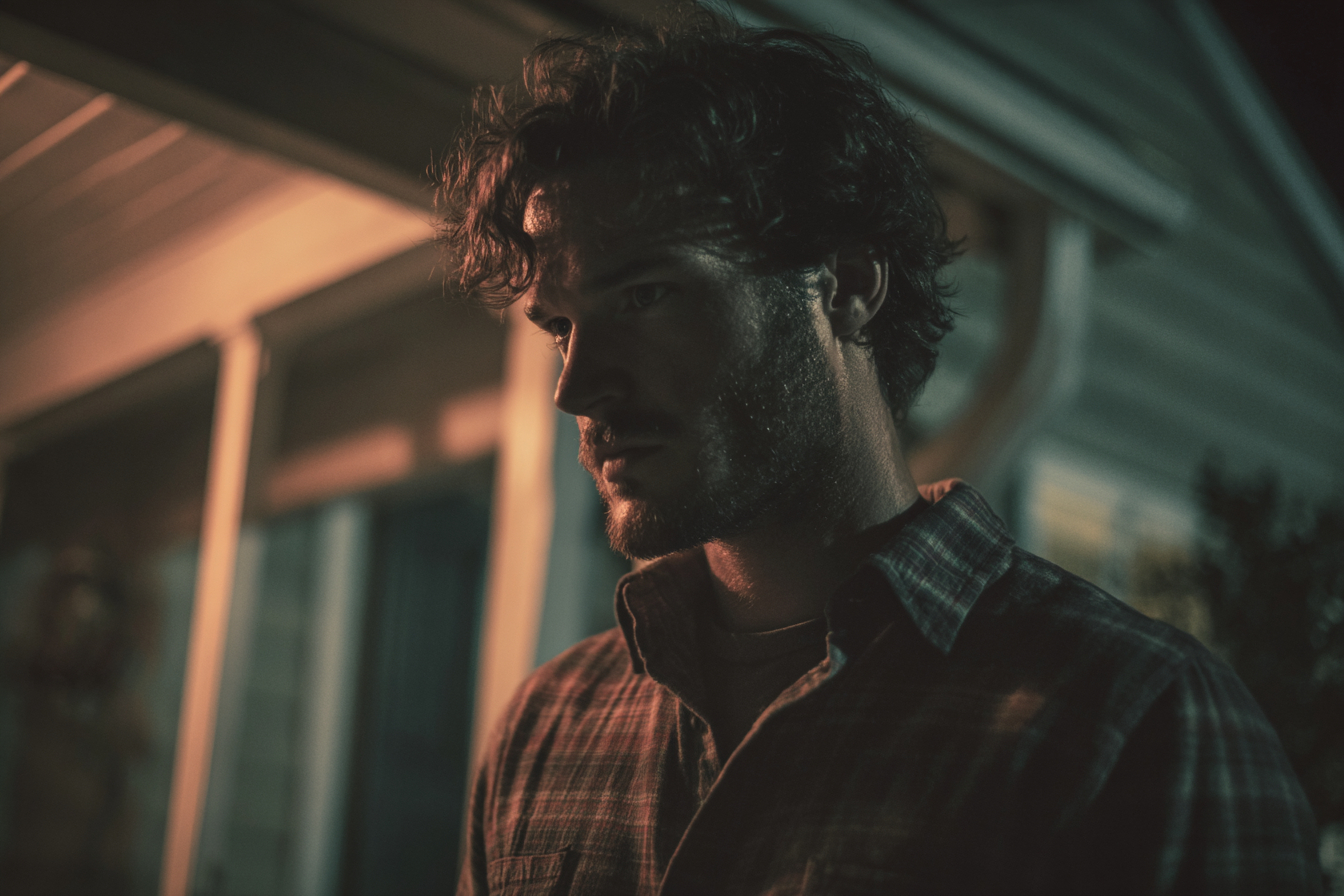 A man standing on the porch | Source: Midjourney