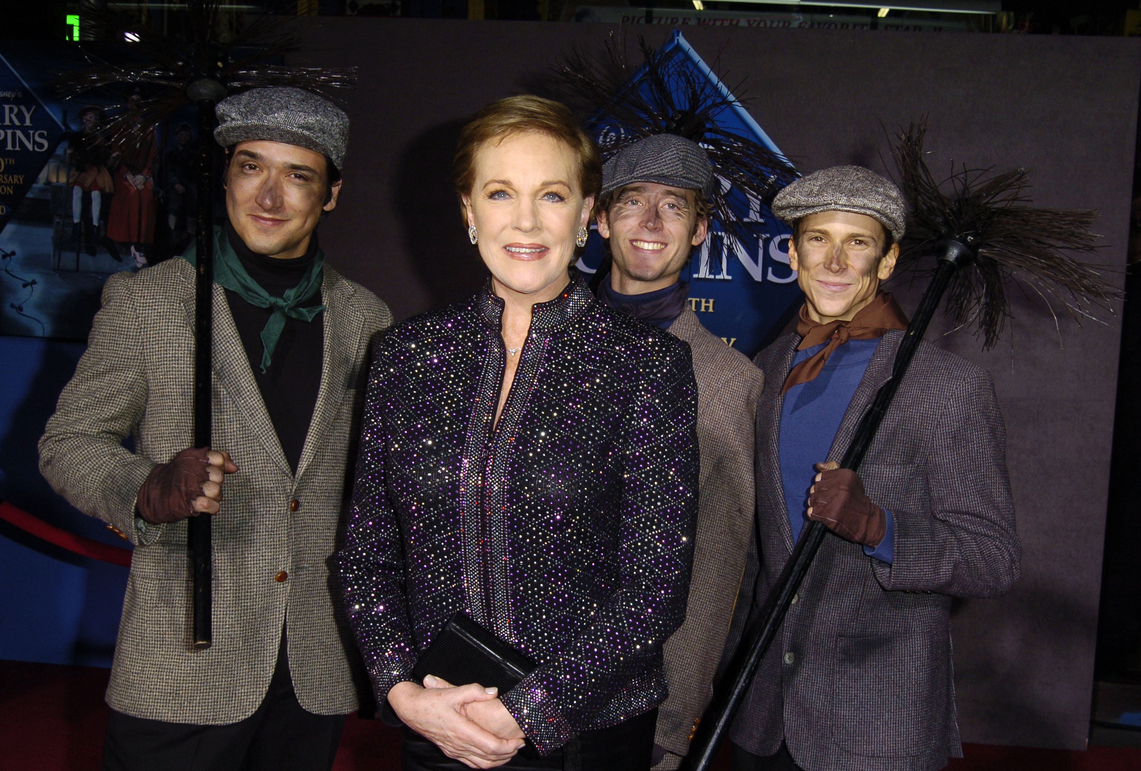 Julie Andrews with chimney sweeps during "Mary Poppins" 40th Anniversary and Launch of Special Edition DVD - Arrivals at El Capitan Theatre in Hollywood, California. | Source: Getty Images