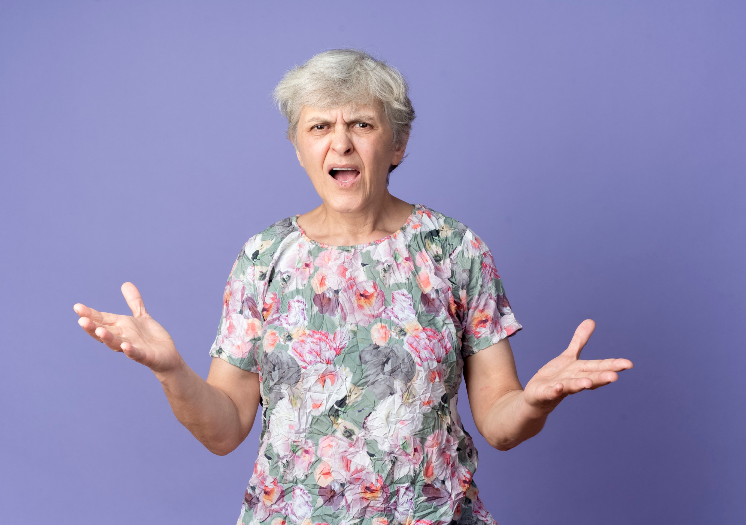 An annoyed older woman | Source: Freepik