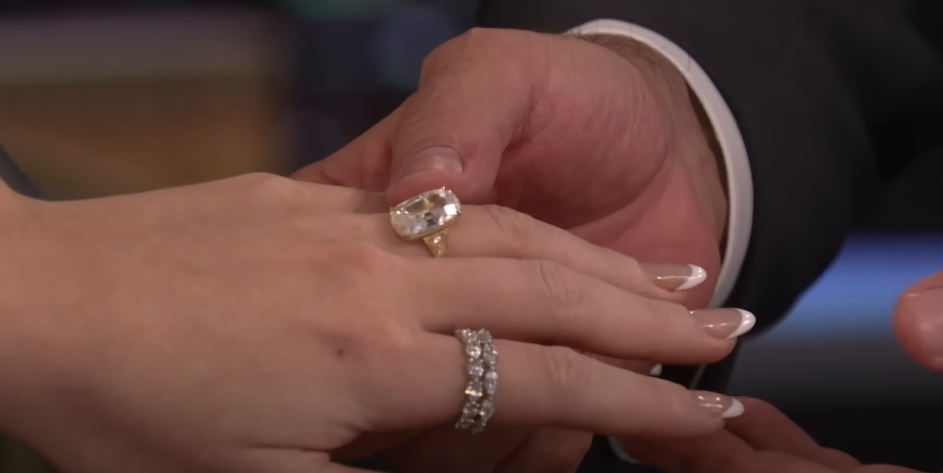 Jimmy Fallon holding Taylor Swift's hand to better show off her engagement ring on October 6, 2025 | Source: Youtube/The Tonight Show Starring Jimmy Fallon