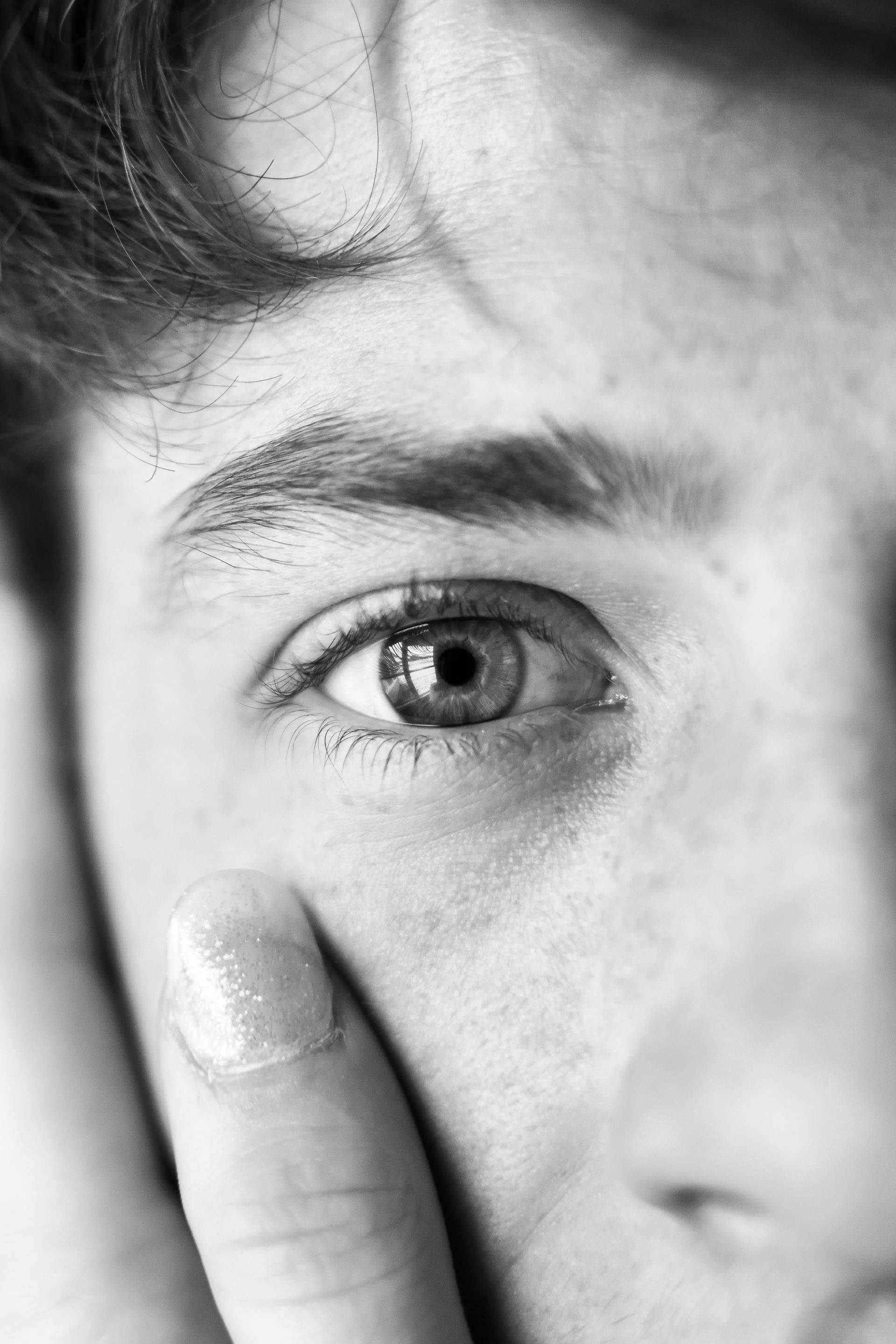 Grayscale photo of a man's eye | Source: Pexels