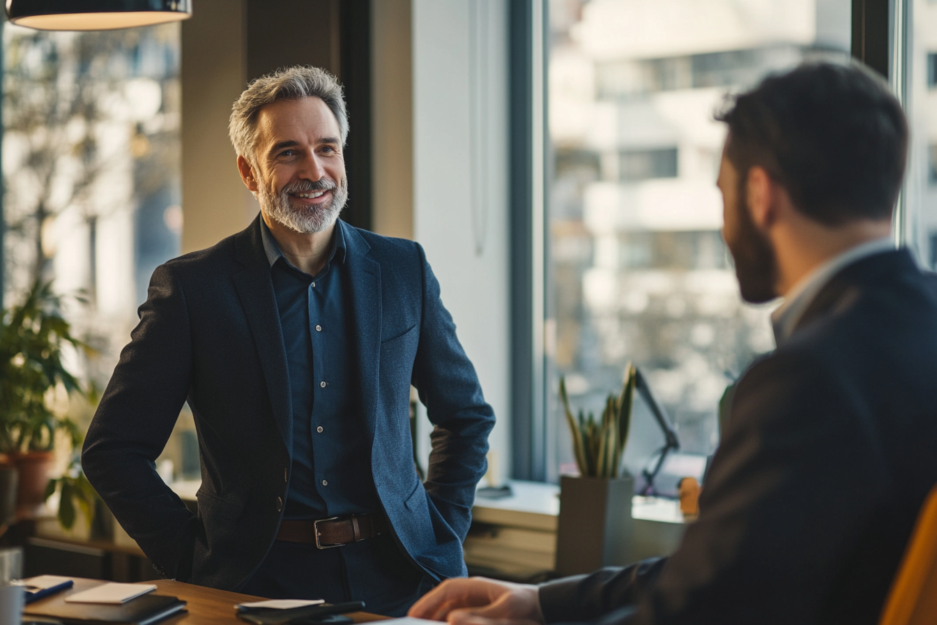 Two men speaking in an office | Source: Midjourney