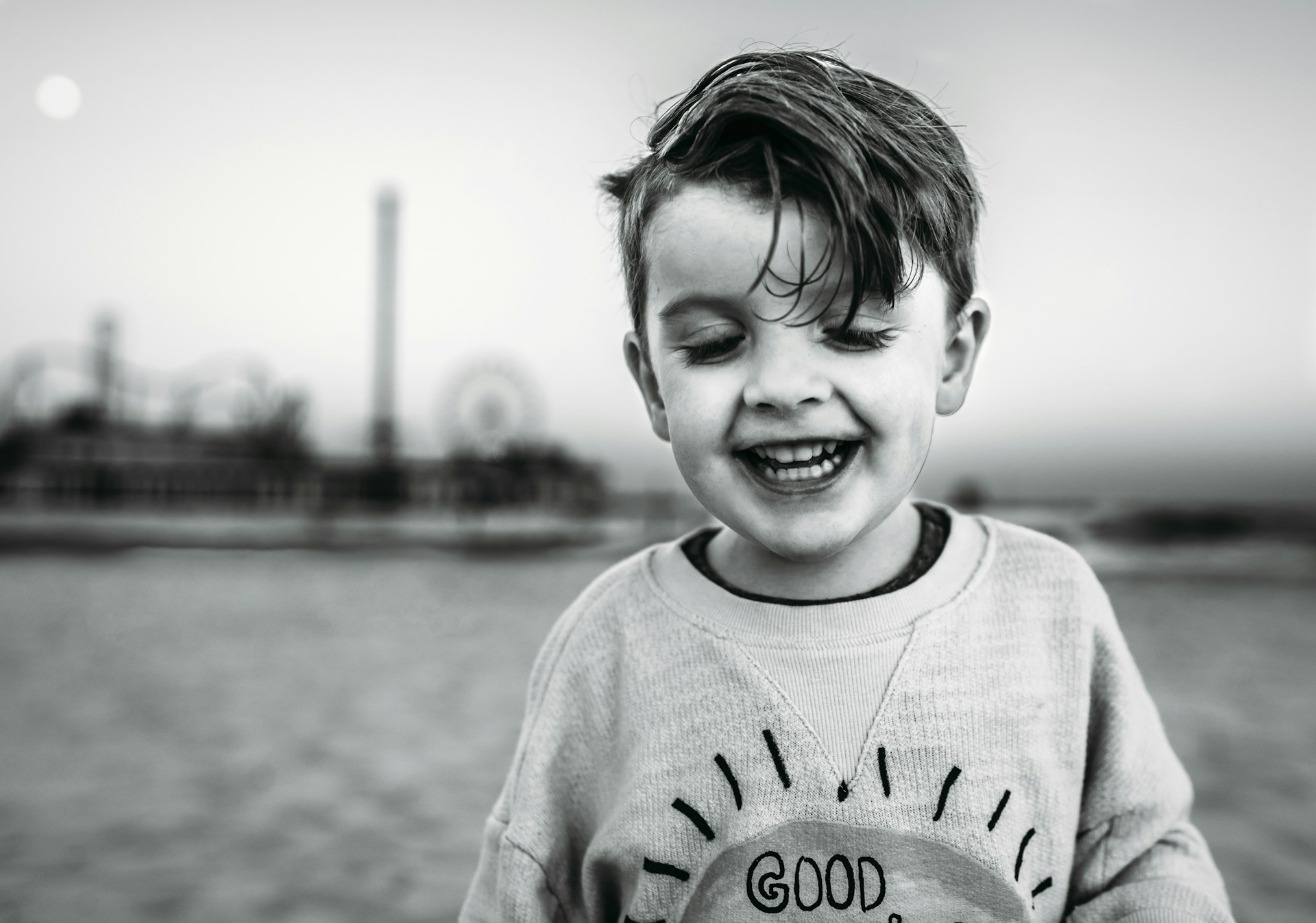 Grayscale shot of an adorable little boy | Source: Unsplash