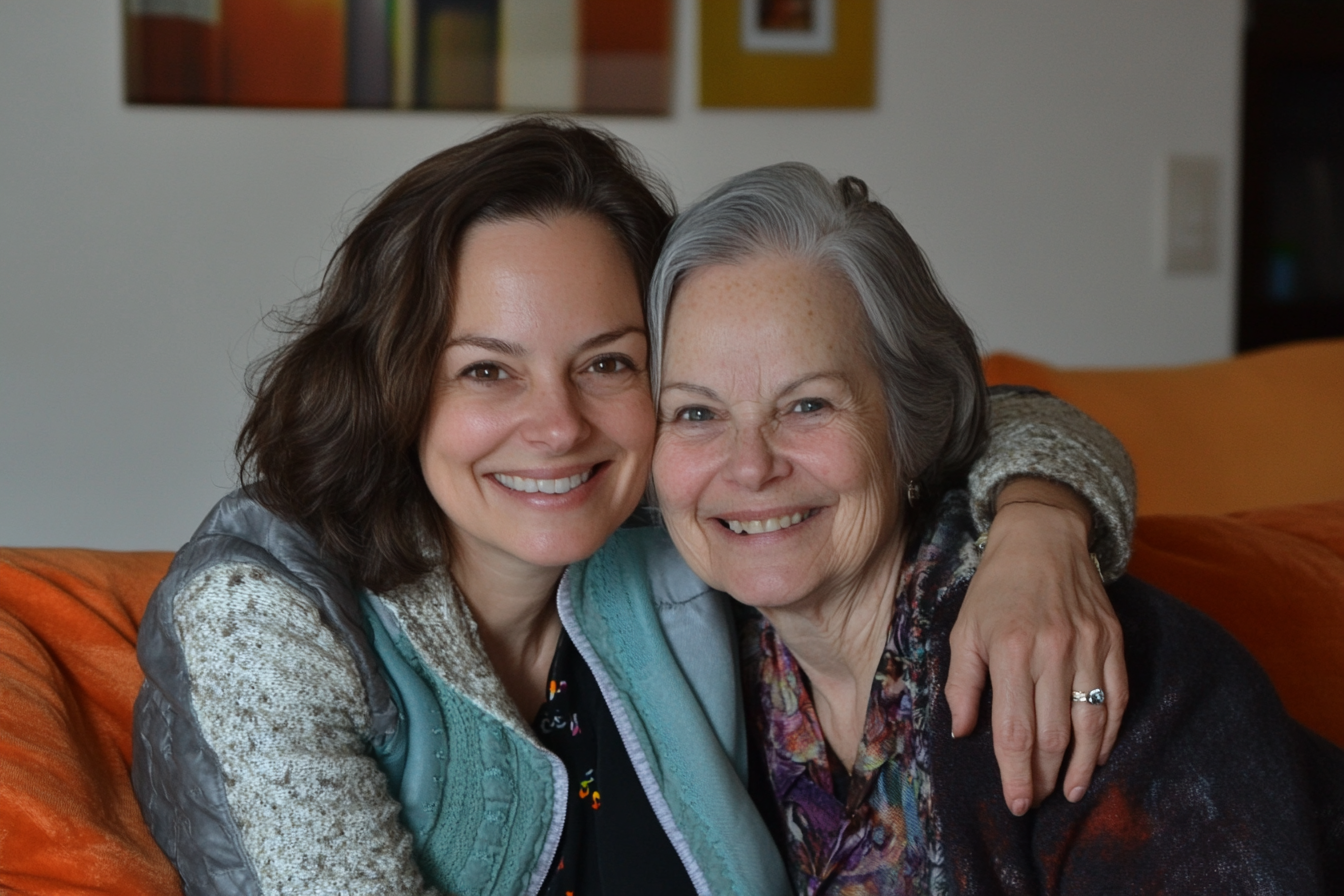 Two women sitting on a sofa | Source: Midjourney