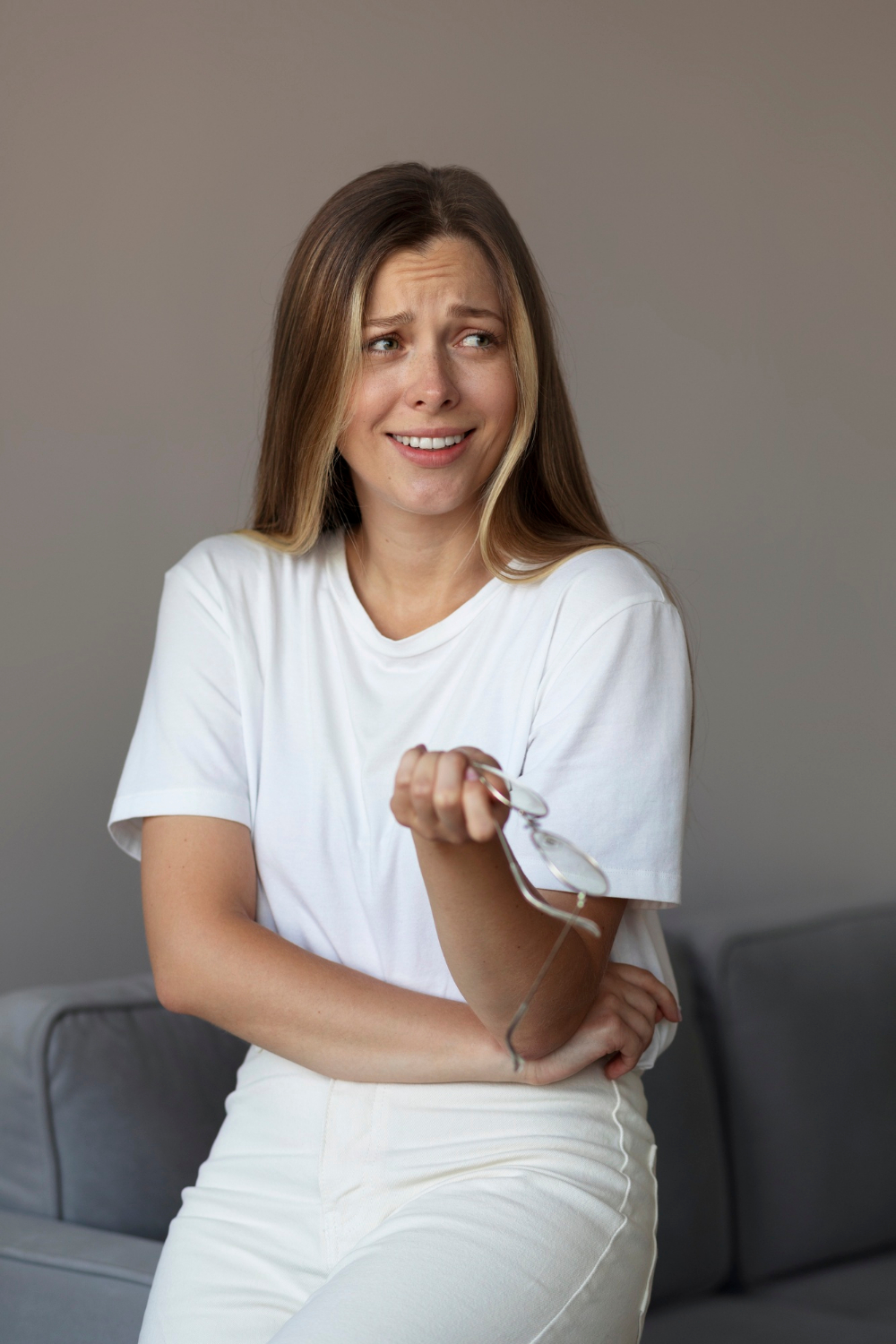 A frustrated woman laughing | Source: Freepik
