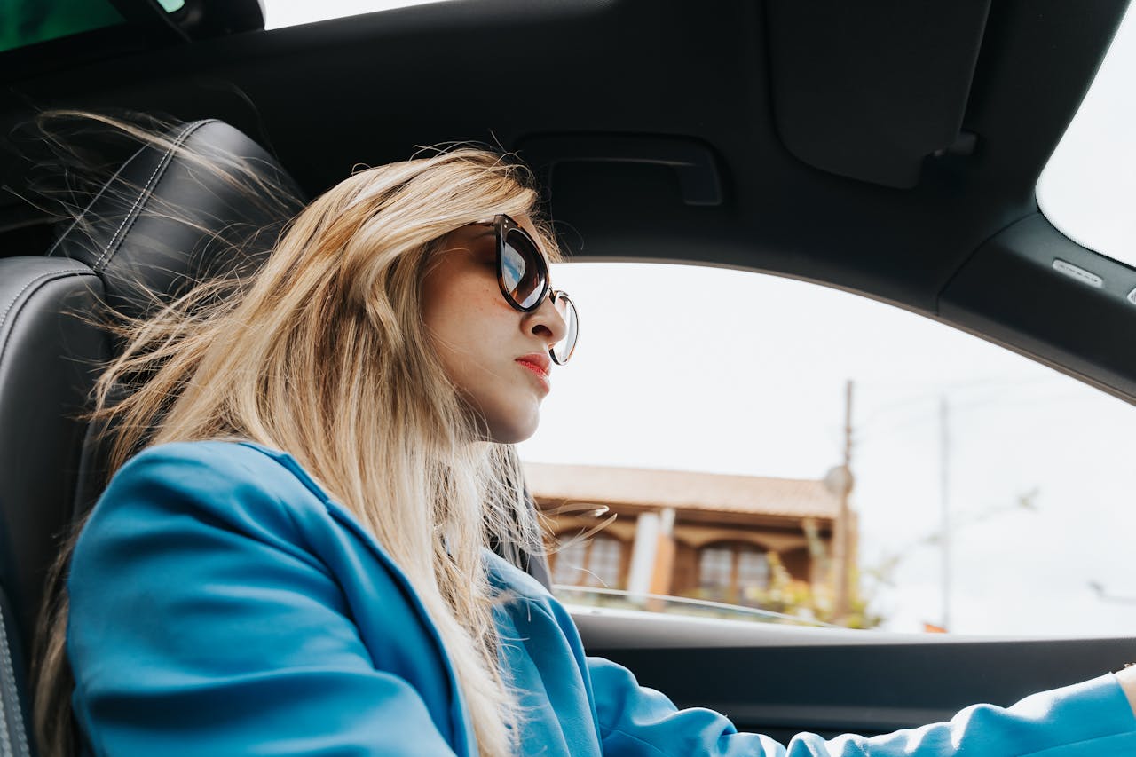 A woman driving a car | Source: Pexels