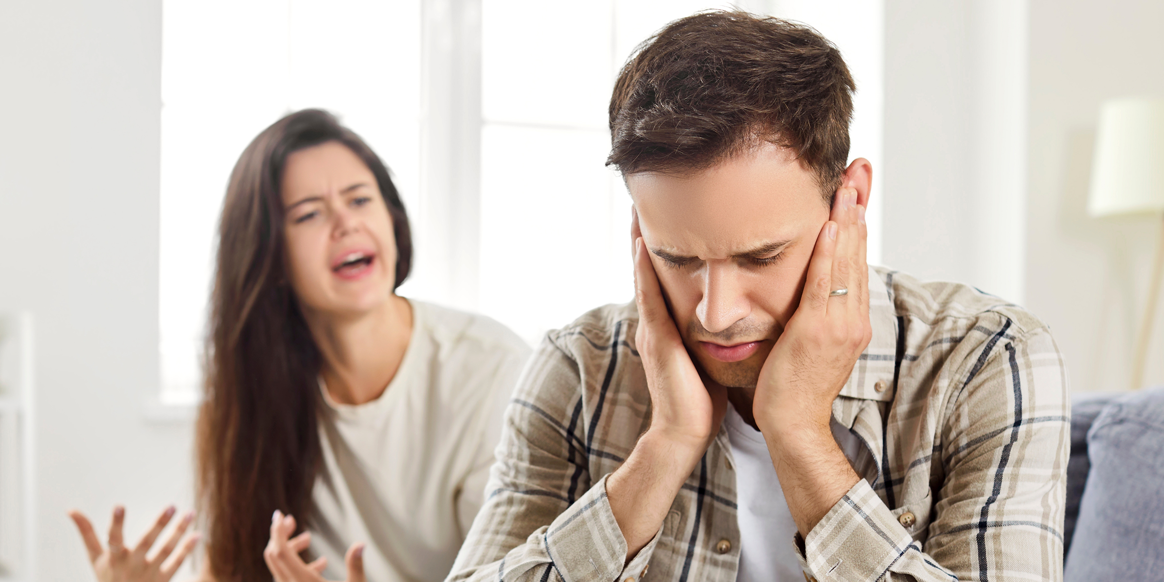 A frustrated woman yelling at a man | Source: Shutterstock