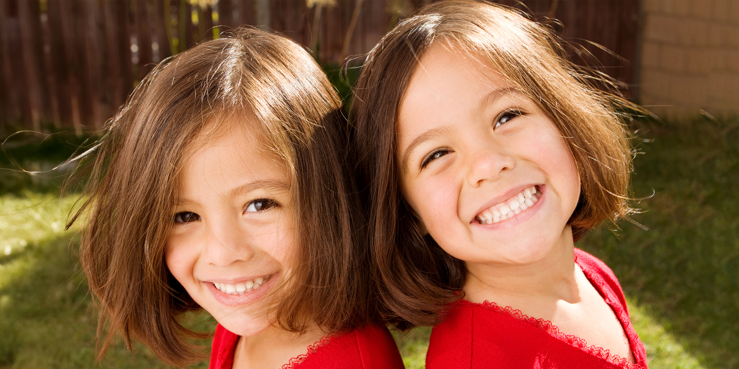 Two happy girls who look alike | Source: Shutterstock