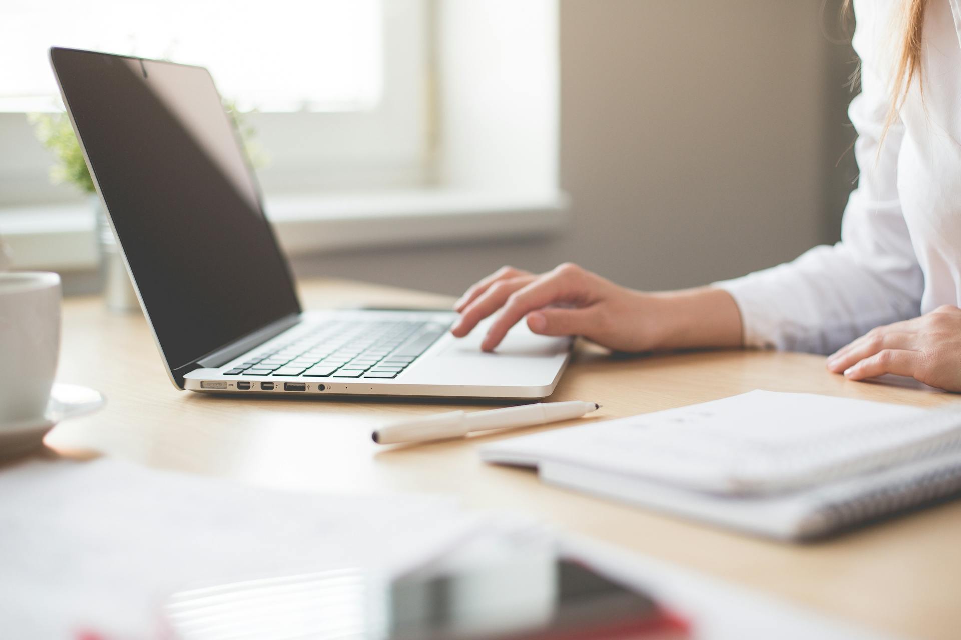 A woman using a laptop | Source: Pexels