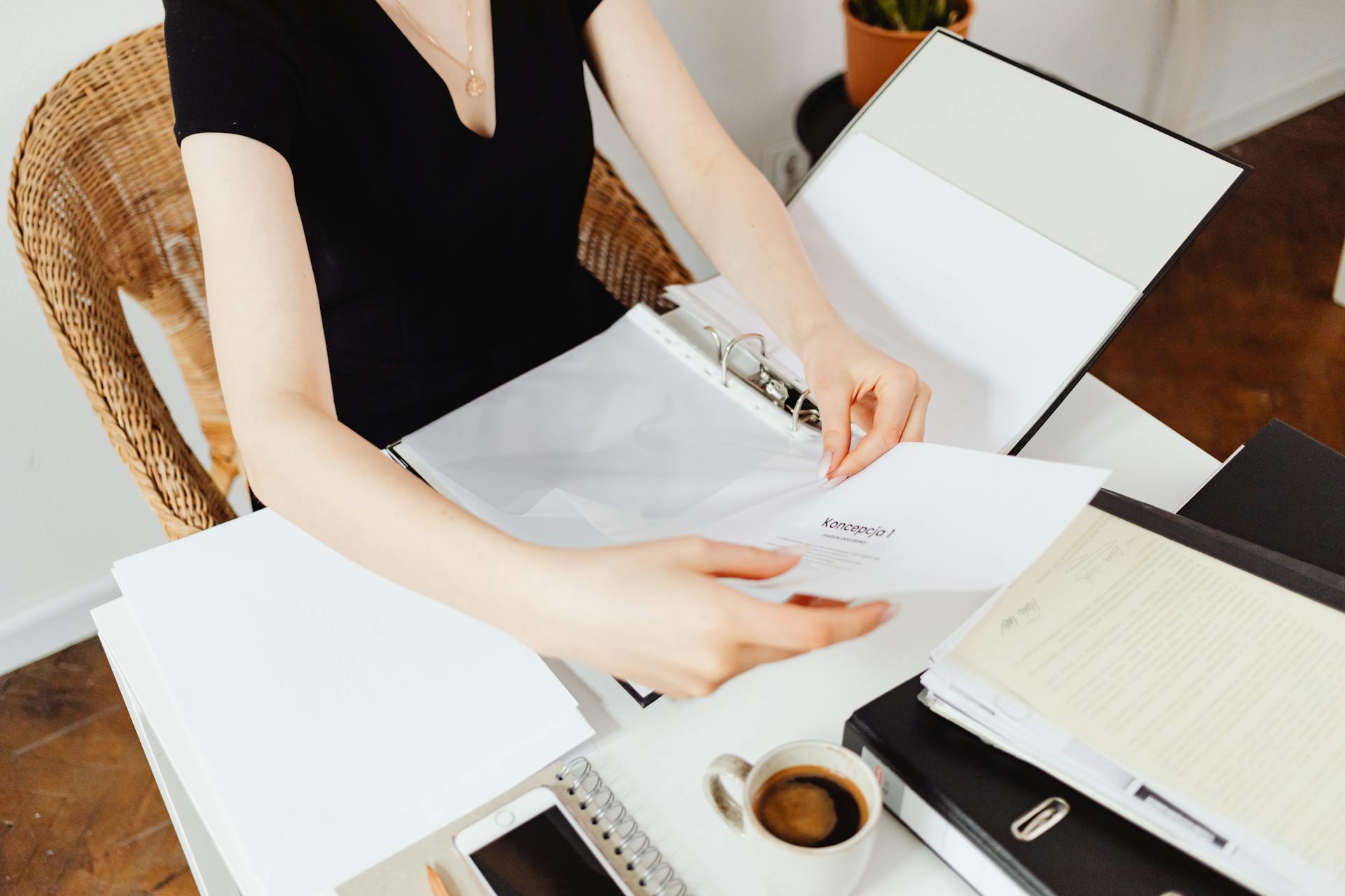 A woman examining documents | Source: Pexels