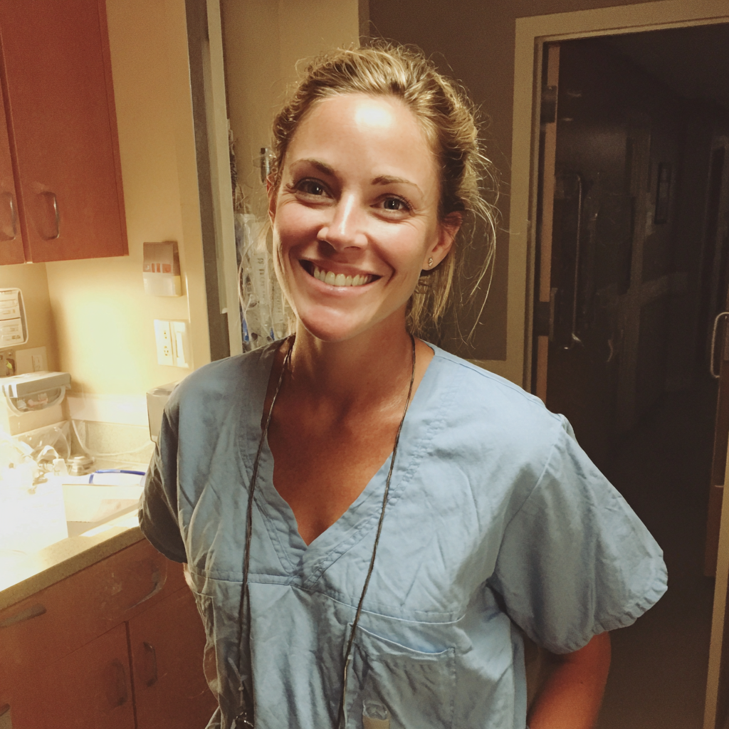A smiling nurse wearing blue scrubs | Source: Midjourney