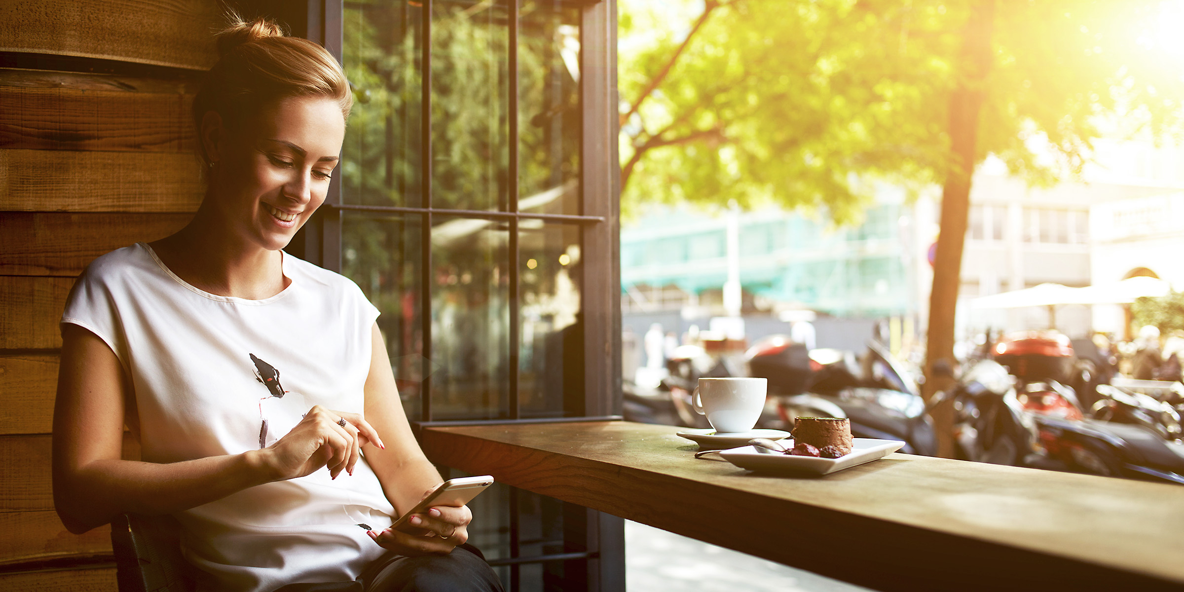 A woman using her phone | Source: Shutterstock