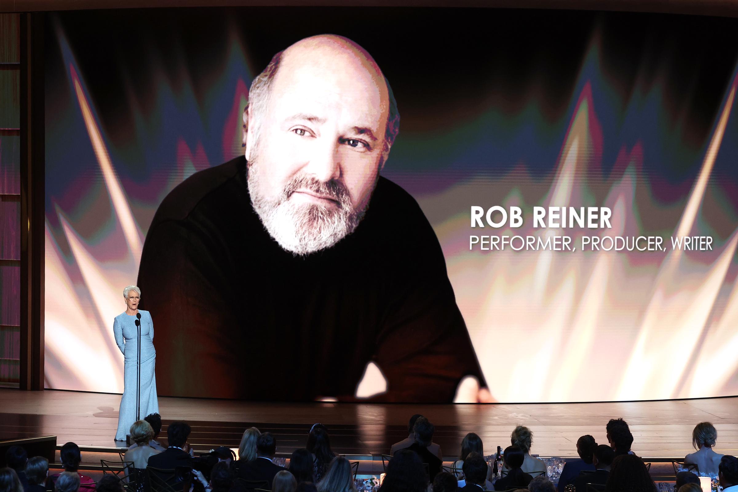 Jamie Lee Curtis speaks onstage during the 78th Emmy Awards as a tribute to Rob Reiner is displayed behind her. | Source: Getty Images