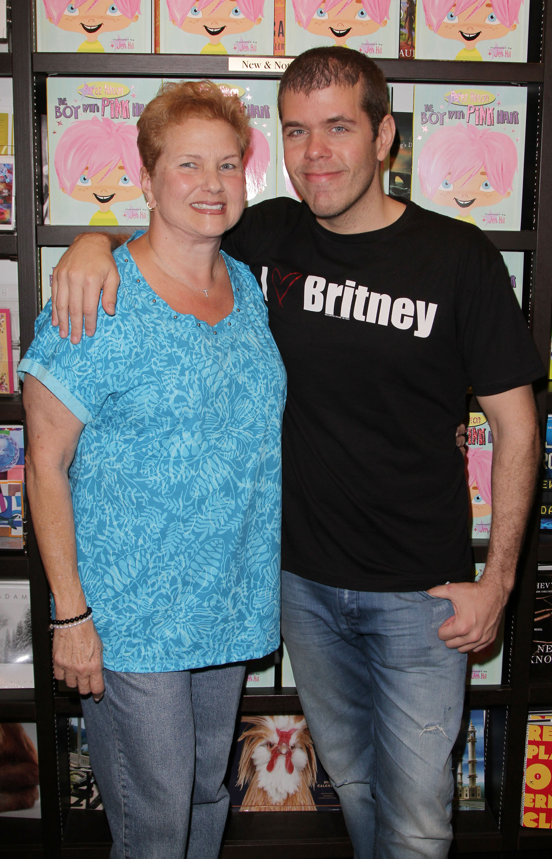 Perez Hilton's and his mother, Teresita Lavandeira, pose during his book signing of the "The Boy With The Pink Hair" at Books and Books on September 17, 2011 in Miami Beach, Florida. | Source: Getty Images