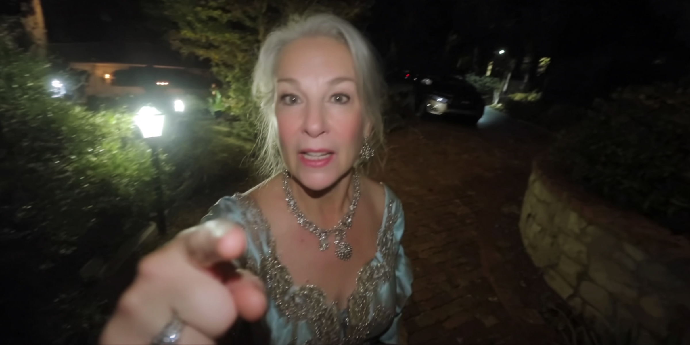 Angry elderly woman pointing at someone in front of her | Source: Midjourney